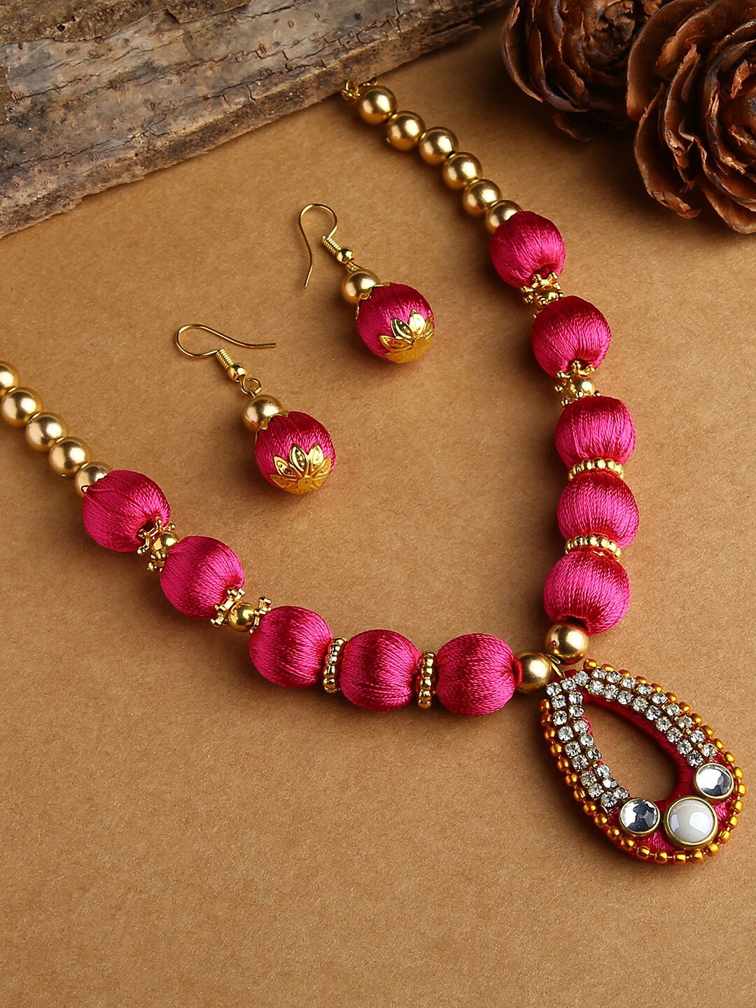 

AKSHARA Gold-Plated & Pink Stone-Studded Wooden Balls Silk Thread Jewellery Set