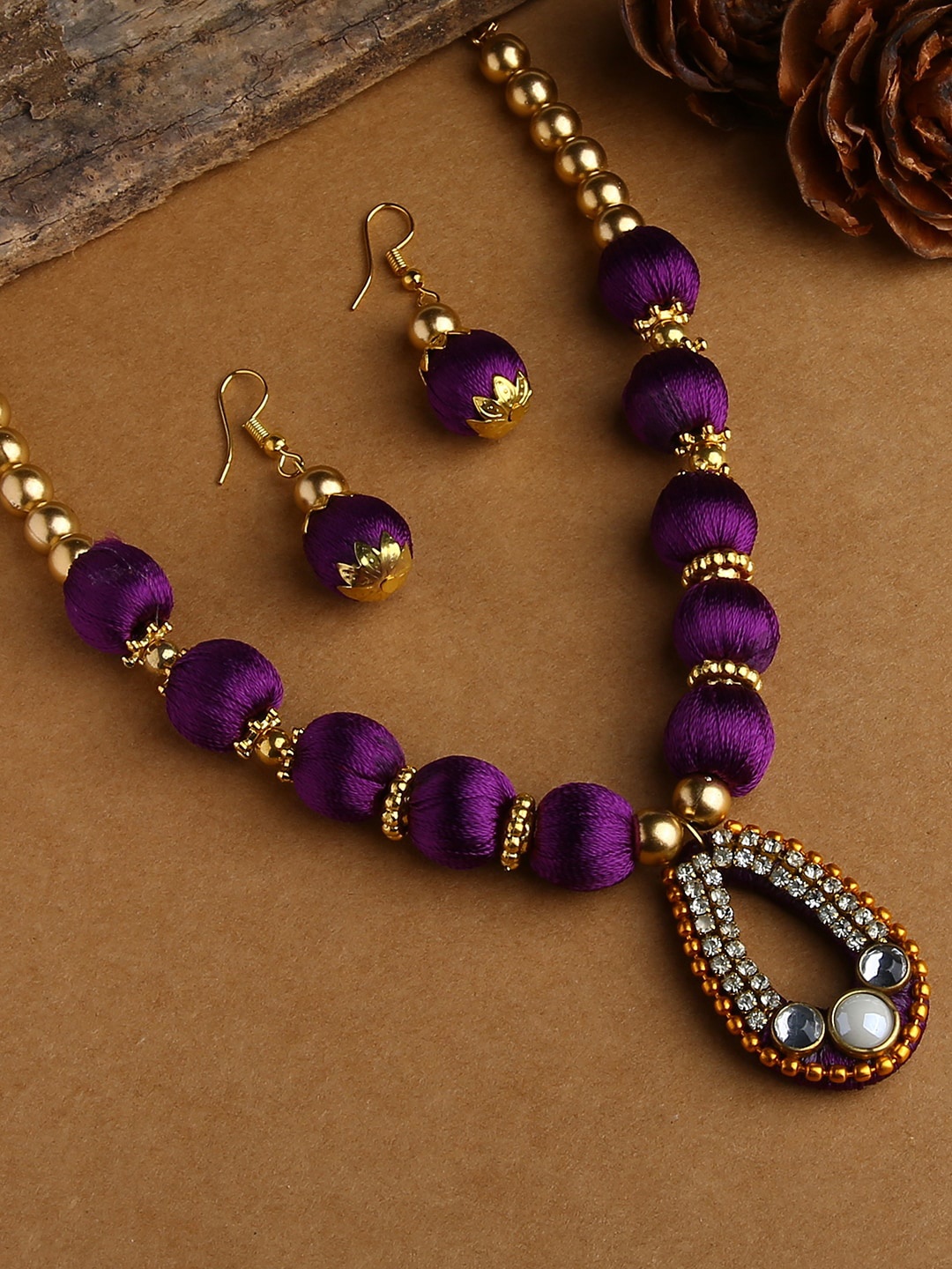 

AKSHARA Gold-Plated &Purple Beaded Jewellery Set