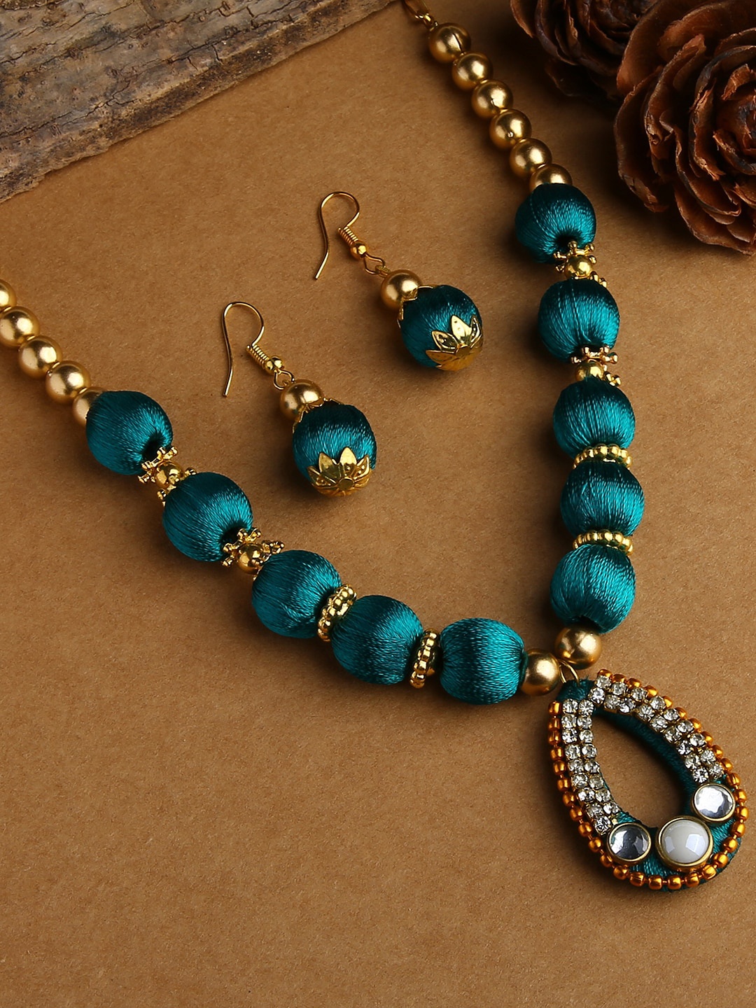 

AKSHARA Gold-Plated & Sea Green Stone-Studded & Beaded Jewellery Set