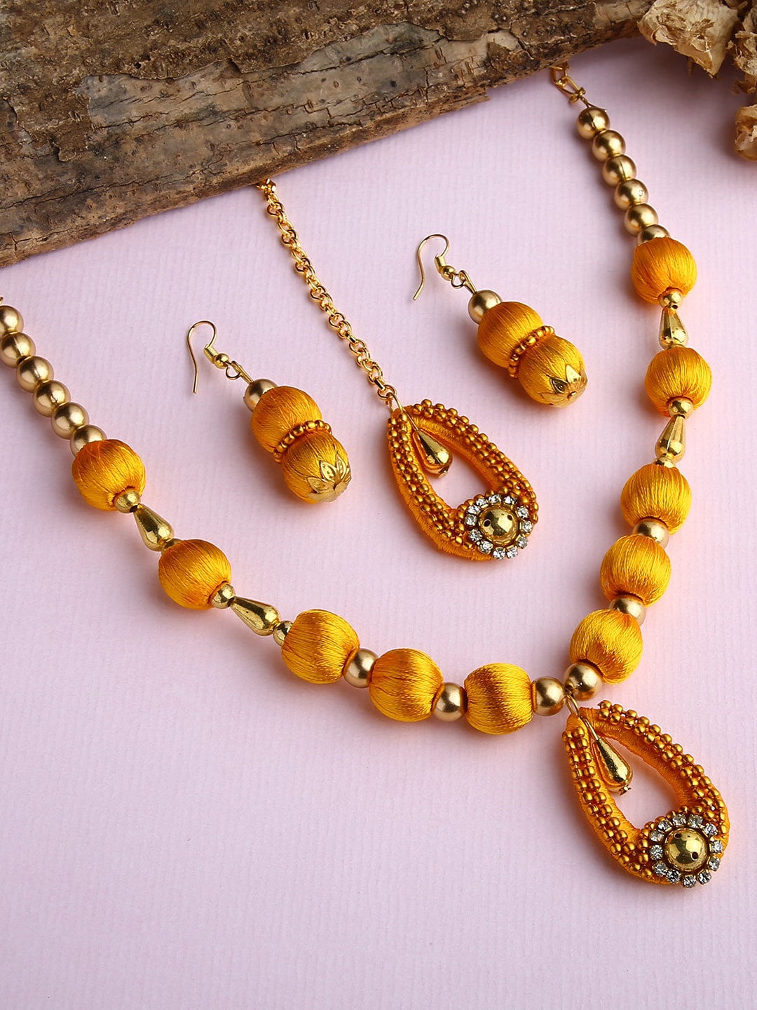 

AKSHARA Gold-Plated Yellow & White Stone-Studded & Beaded Jewellery Set