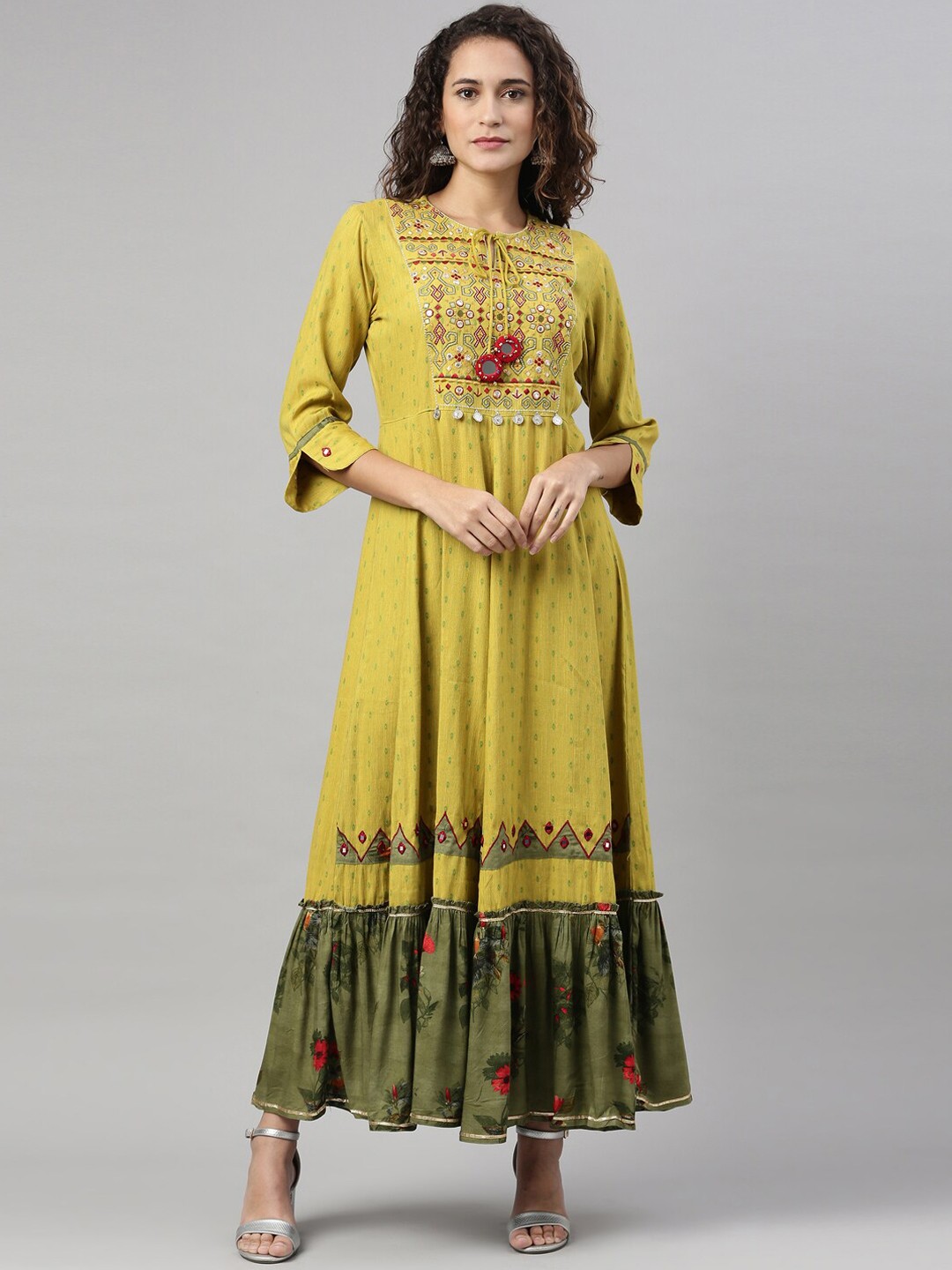 

Neerus Women Green Embroidered Keyhole Neck Flared Sleeves Thread Work Anarkali Kurta