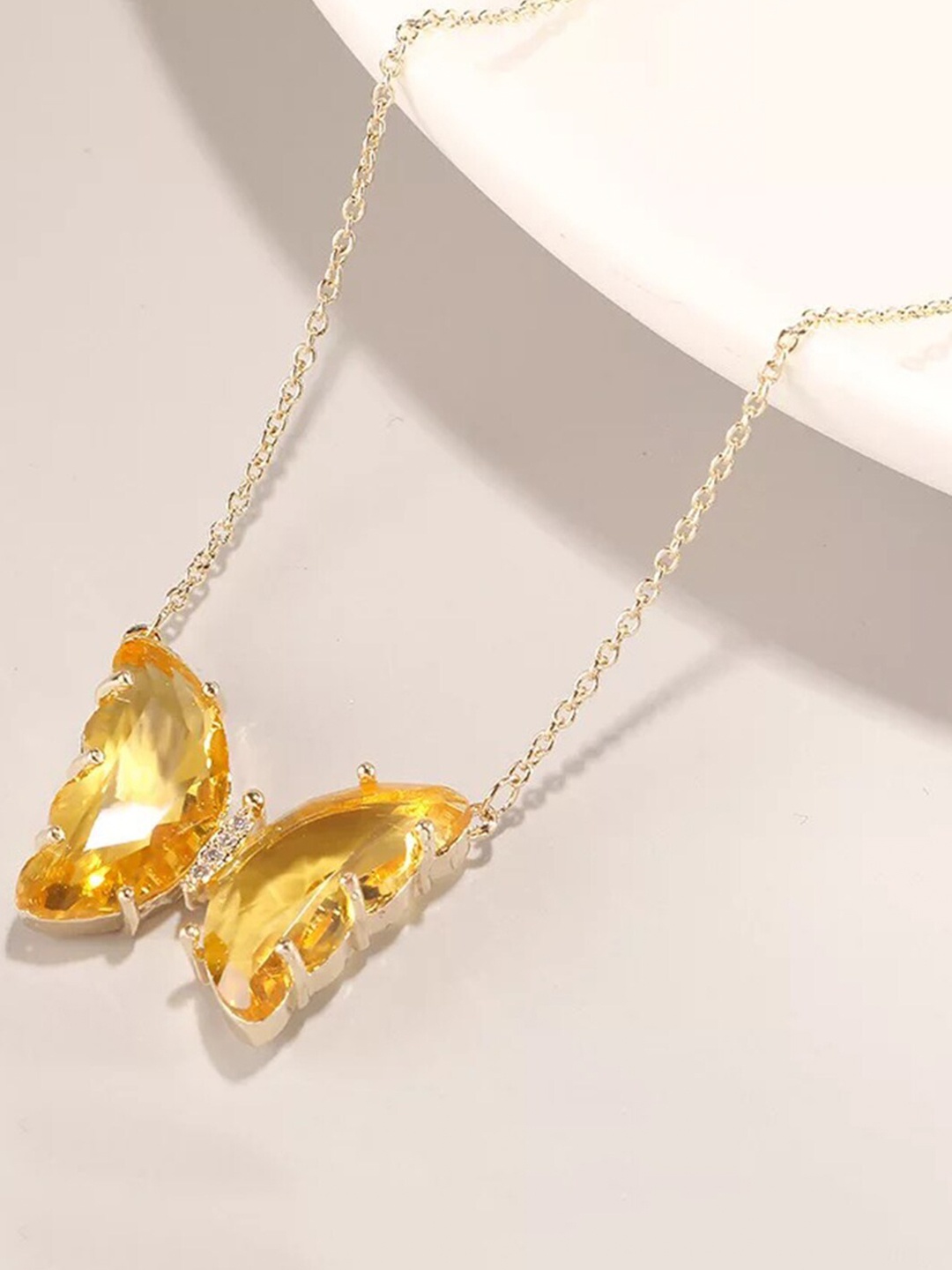 

Vembley Women Gold-Toned & Yellow Crystal Studded Butterfly Pendant Necklace