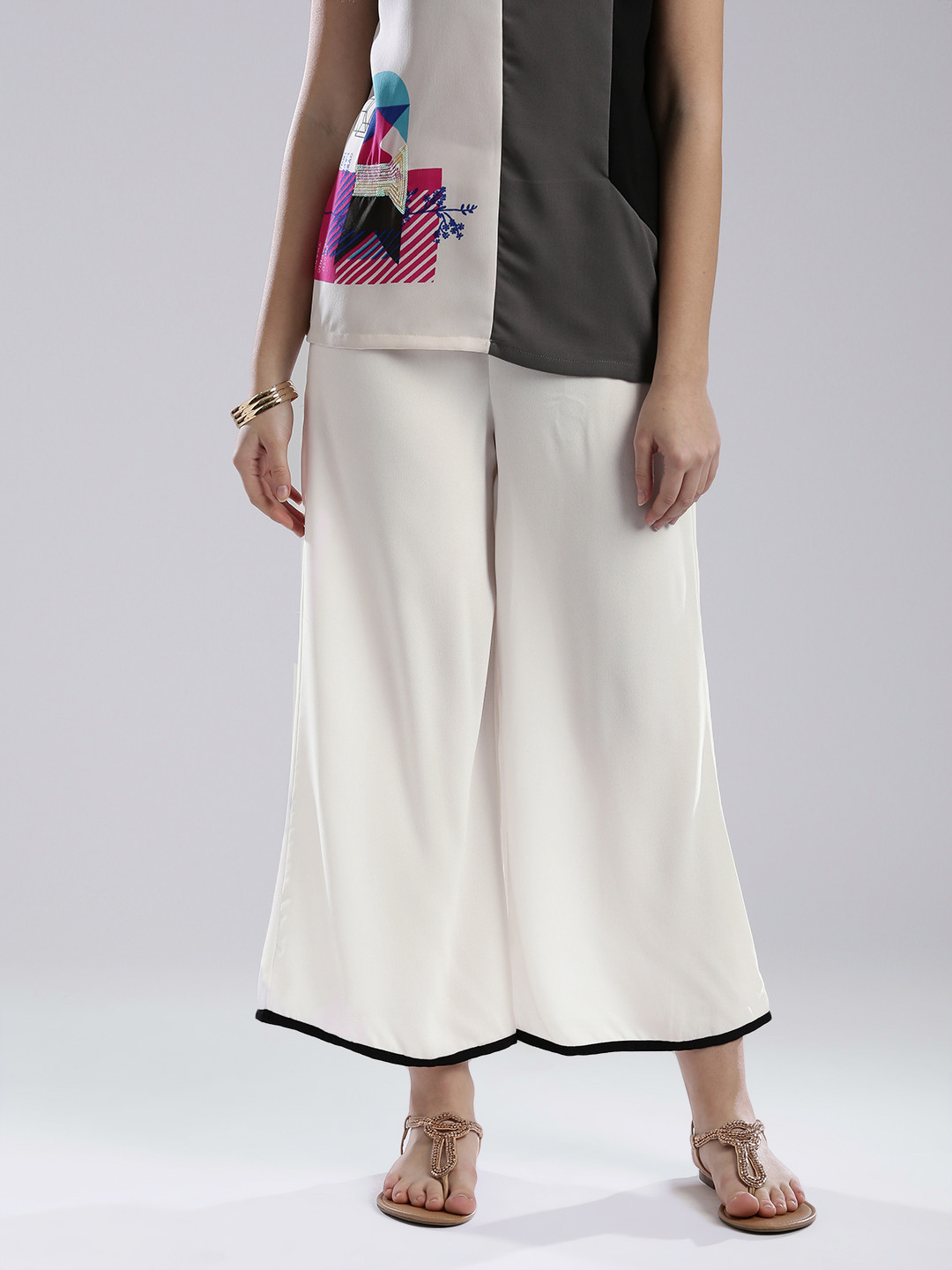 

W Women White Solid Palazzo Trousers