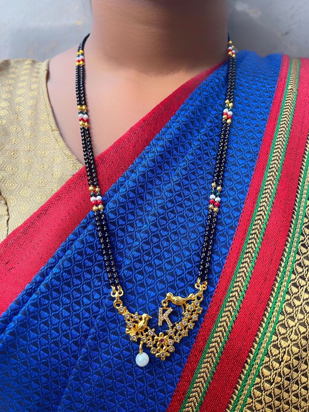 

Digital Dress Room Gold-Plated Black & White Beaded & Stone-Studded R-Alphabet Mangalsutra