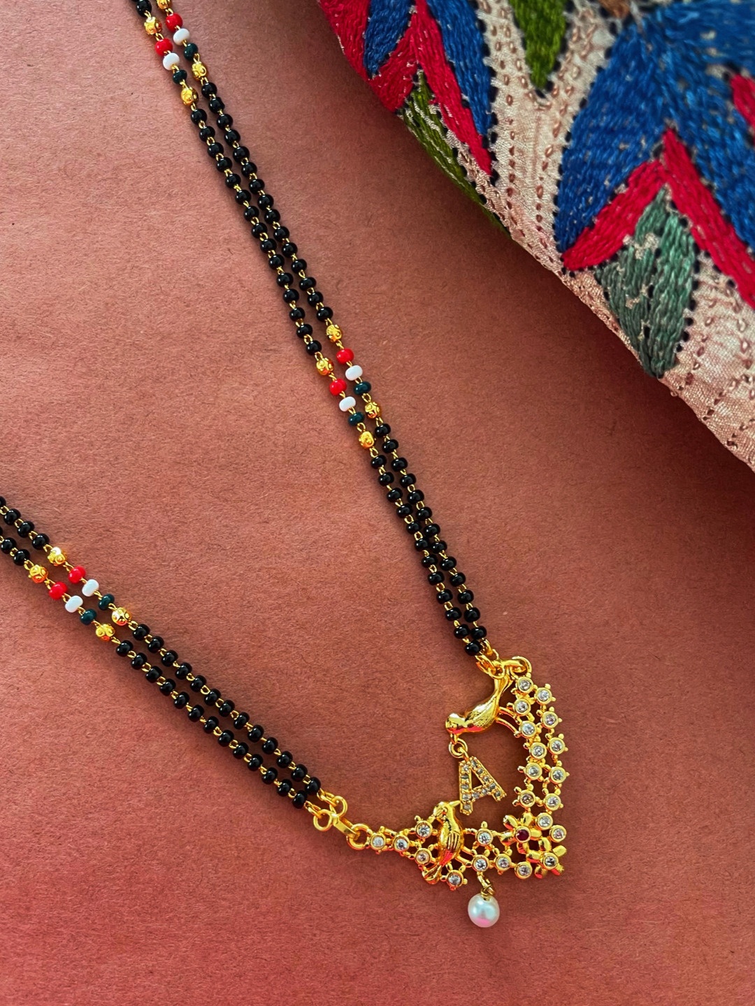 

Digital Dress Room Gold-Plated Black & White Beaded & Stone-Studded A-Alphabet Mangalsutra