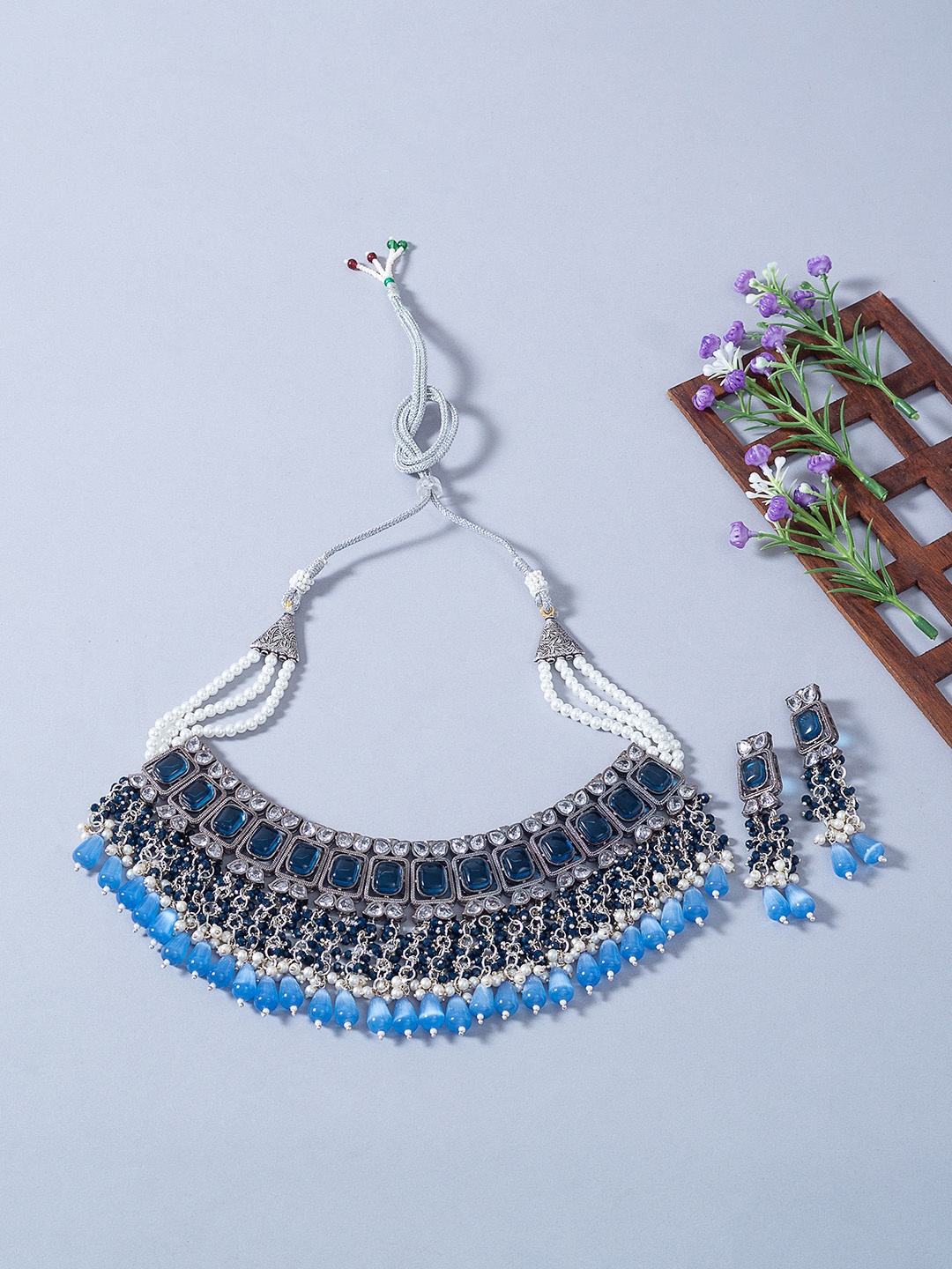 

Golden Peacock Silver-Toned Navy Blue Kundan-Studded Handcrafted Choker Jewellery Set