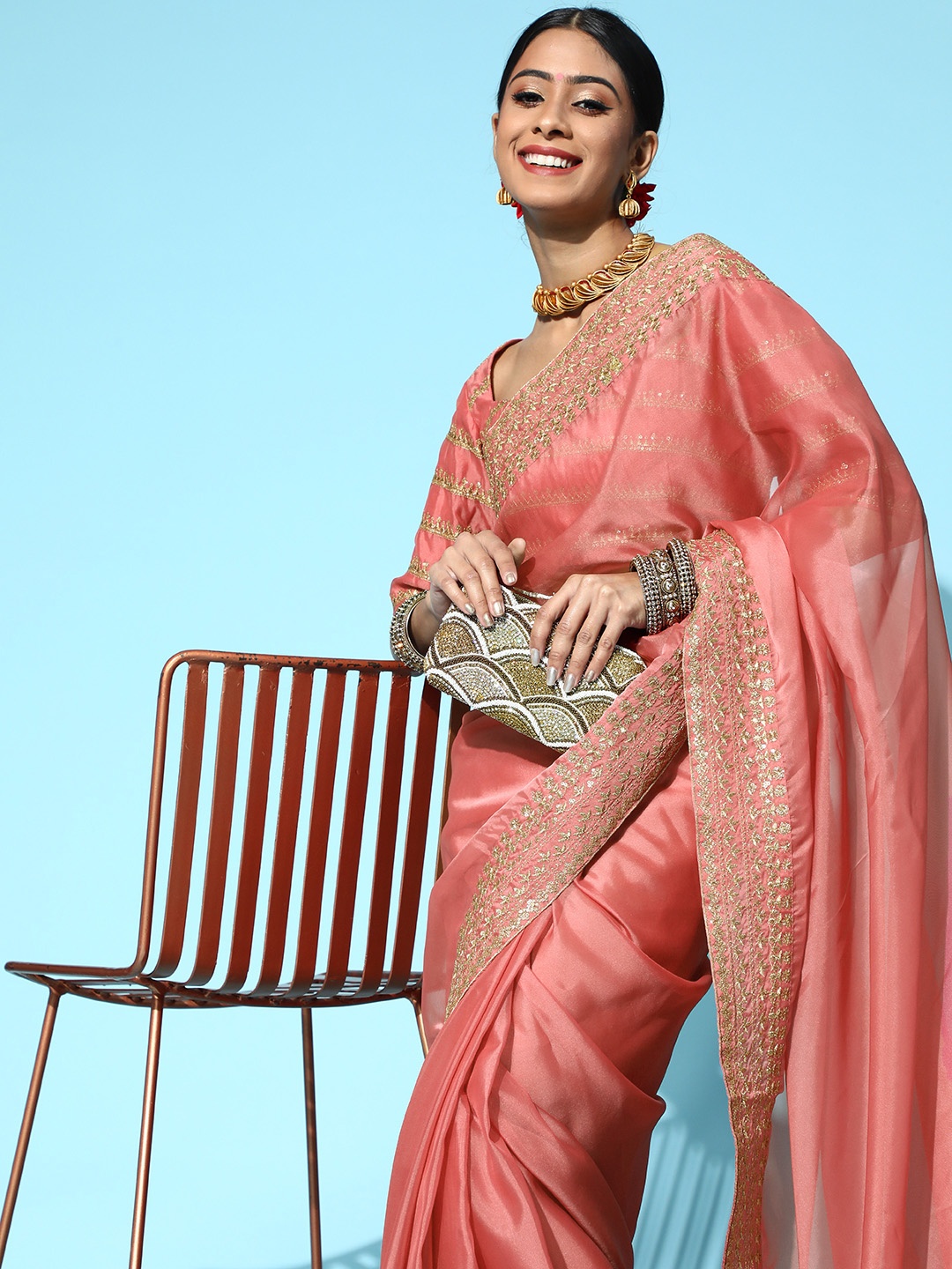 

Inddus Pink organza saree with embroidered border and blouse piece
