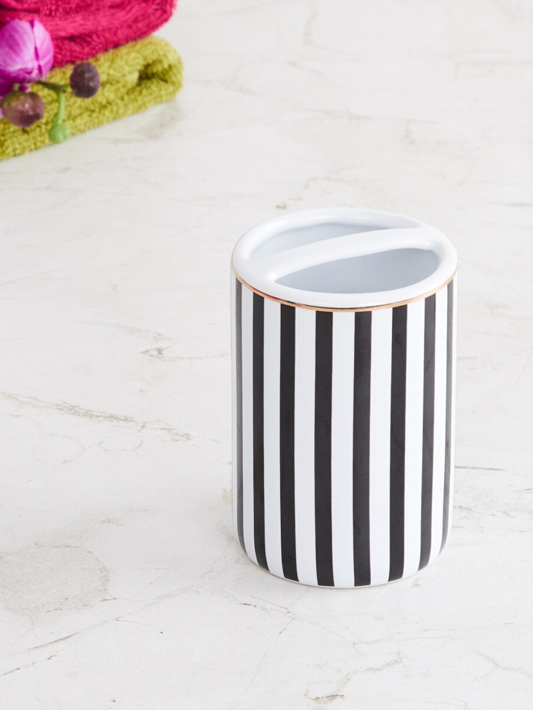 

Home Centre Black And White Ceramic Toothbrush Holder