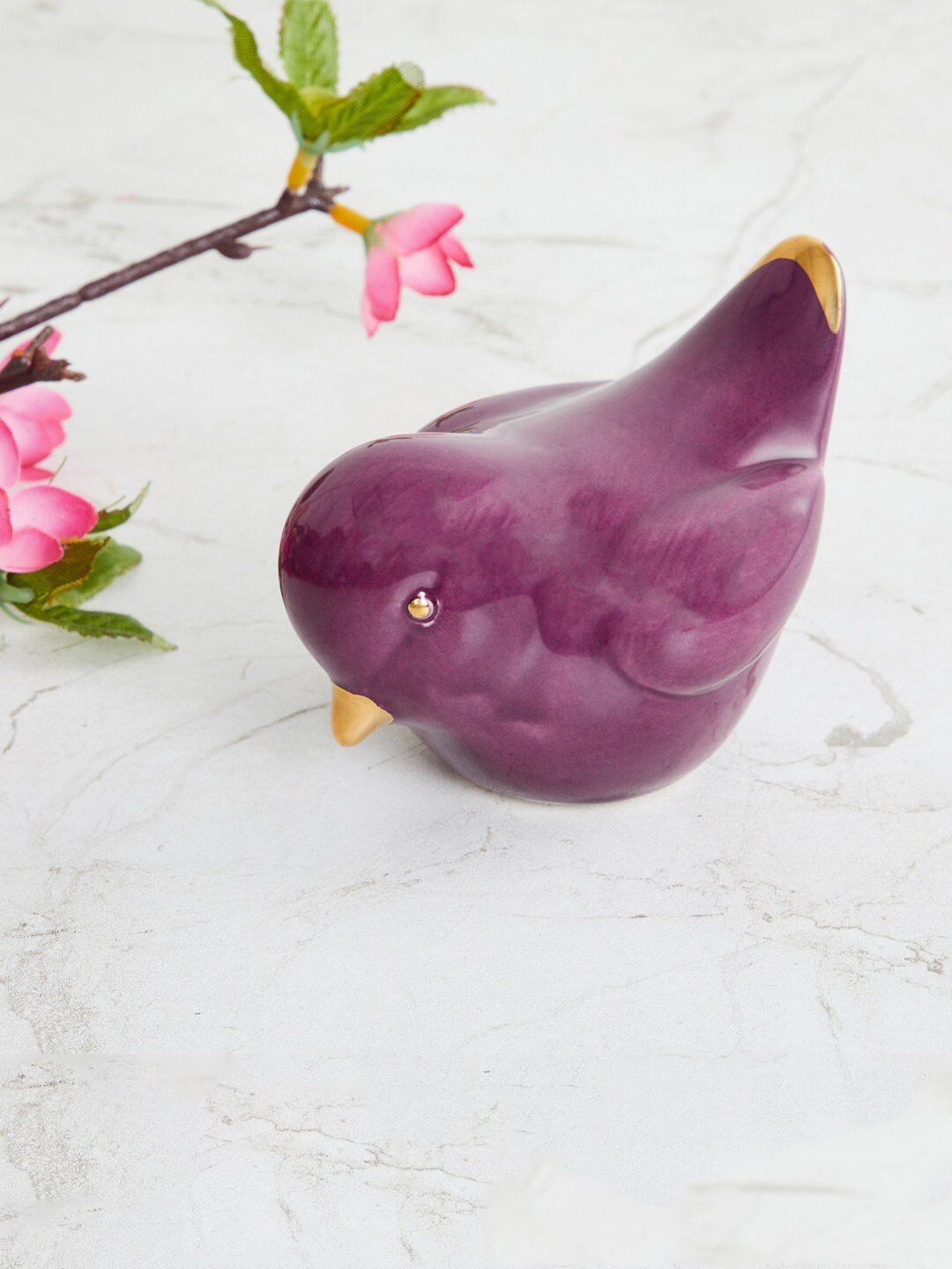 

Home Centre Purple Ceramic Bird Figurine