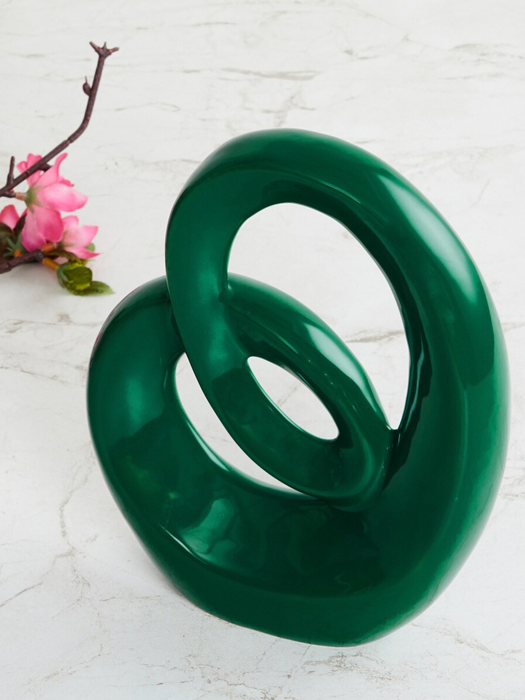 

Home Centre Green Solid Ceramic Abstract Showpiece Figurine