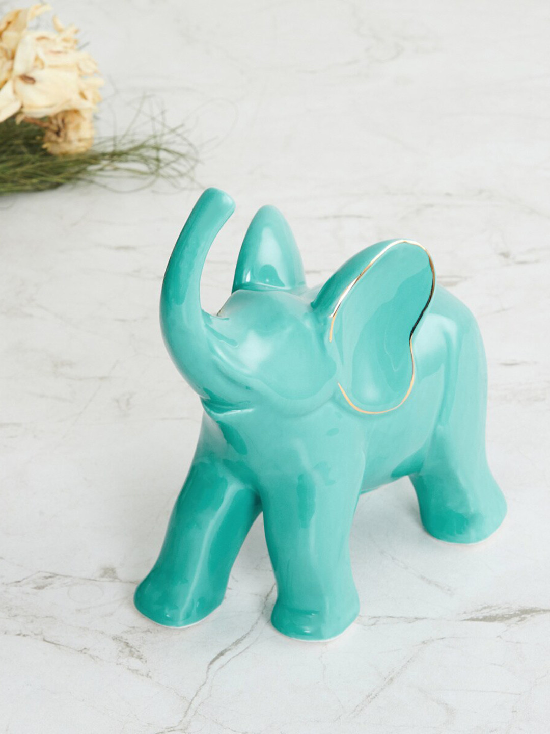 

Home Centre Blue Ceramic Elephant Showpieces