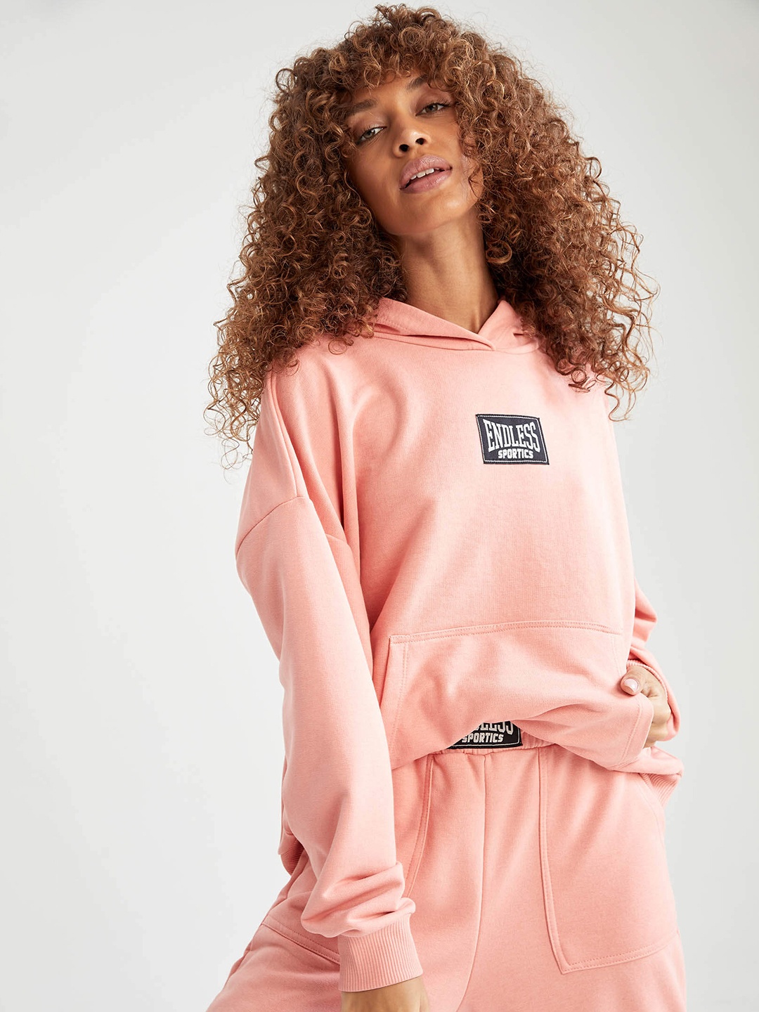 

DeFacto Women Peach-Coloured & Black Typography Print Hooded Sweatshirt