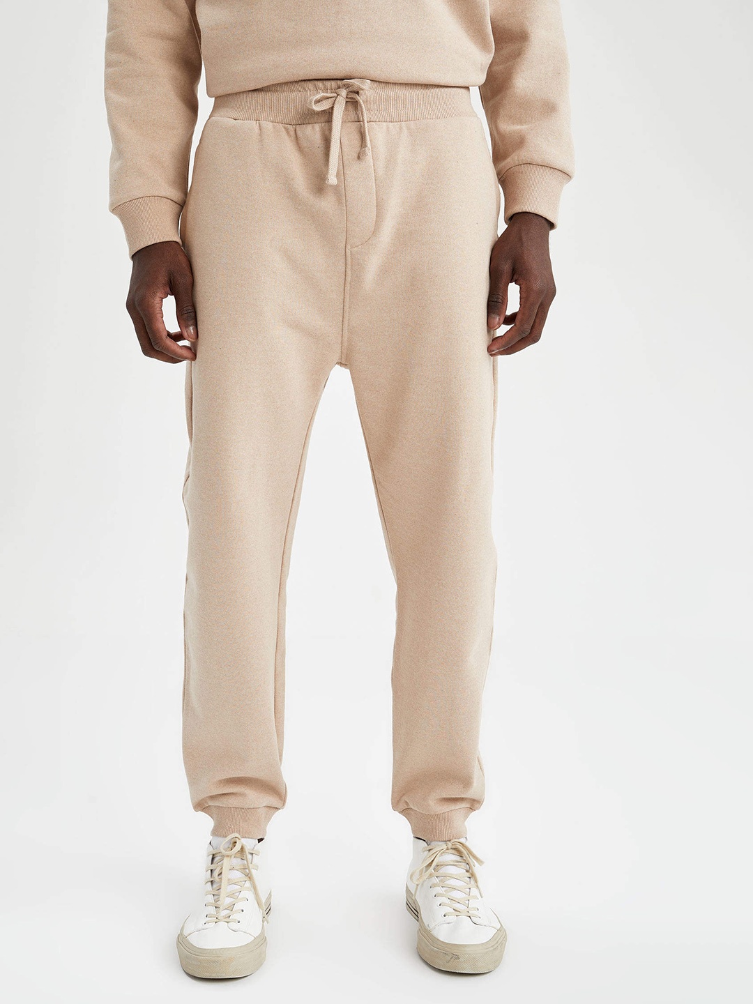 

DeFacto Men Beige Solid Joggers