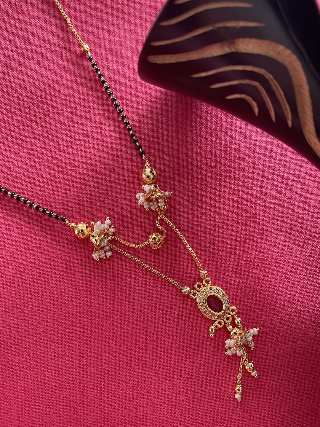 

Digital Dress Room Gold-Plated Red & Black Stone-Studded & Beaded Mangalsutra
