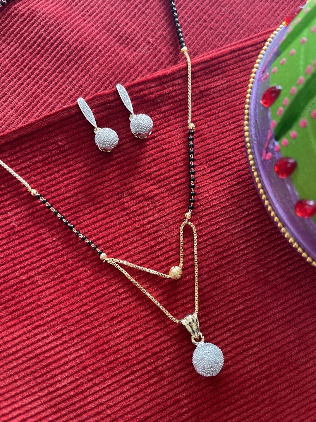 

Digital Dress Room Gold-Plated Blue & Black Stone Studded & Beaded Mangalsutra With Earrings
