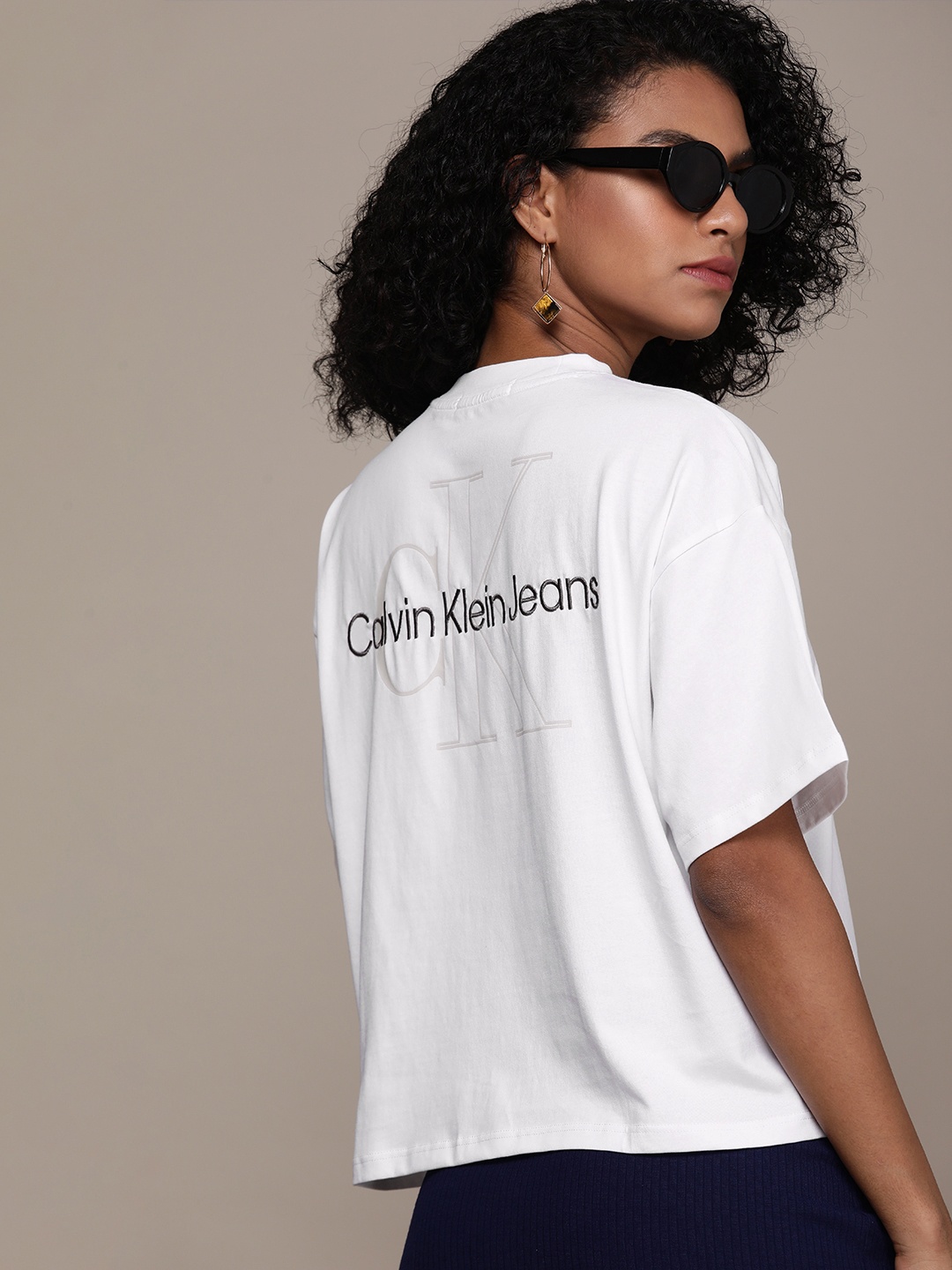 

Calvin Klein Jeans Women White & Black Printed Extended Sleeves T-shirt