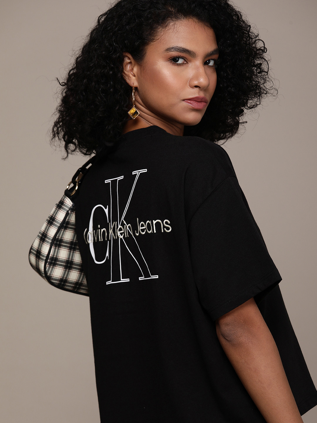 

Calvin Klein Jeans Women Black & White Printed Extended Sleeves T-shirt