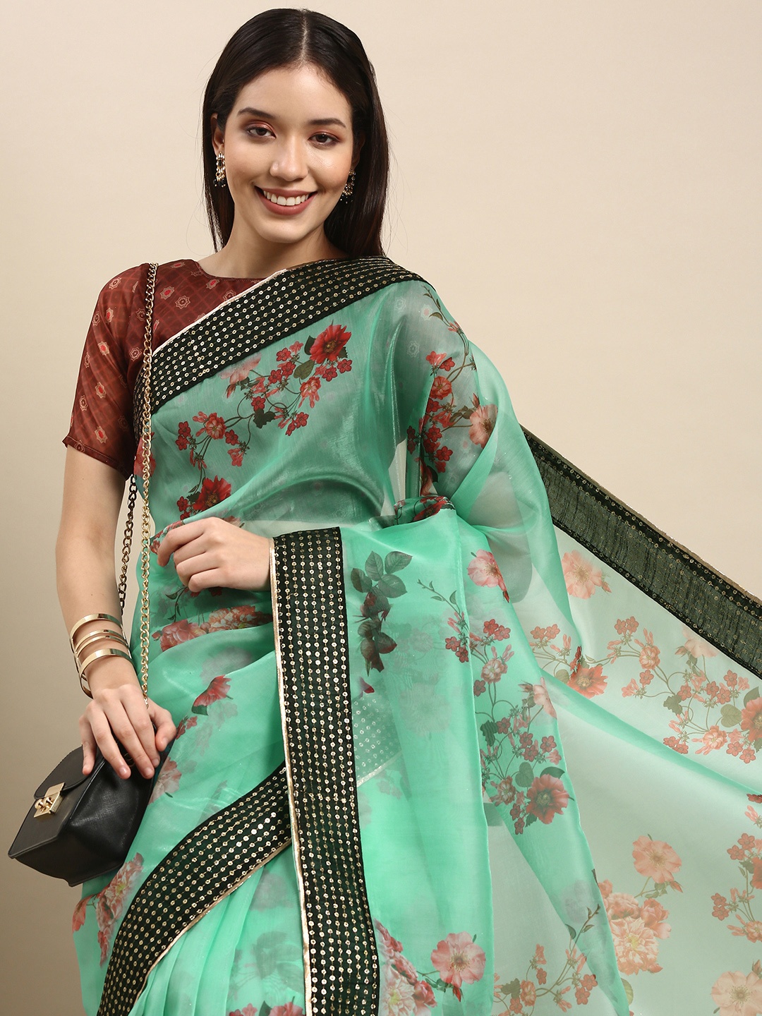 

Anouk Turquoise Blue & Red Floral Printed Sequinned Organza Saree with Embellished Border