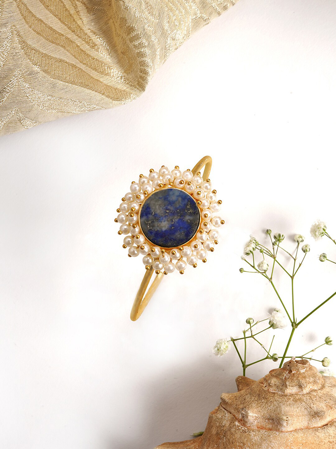 

TEEJH Women Gold-Toned & Blue Stone Studded Gold-Plated Cuff Bracelet