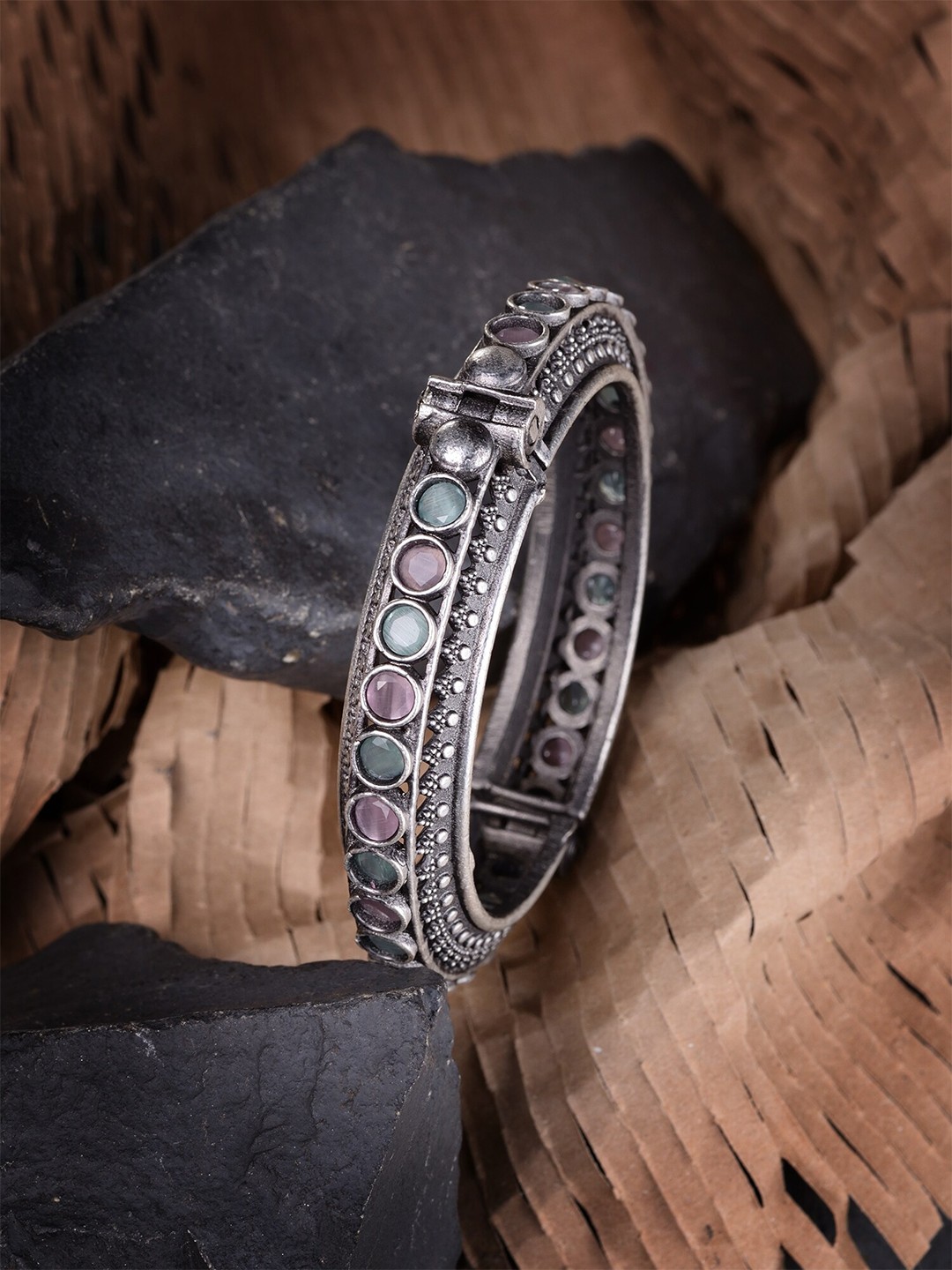 

Saraf RS Jewellery Women Silver Toned Oxidised Pink Mint Stone Studded Kada Bracelet