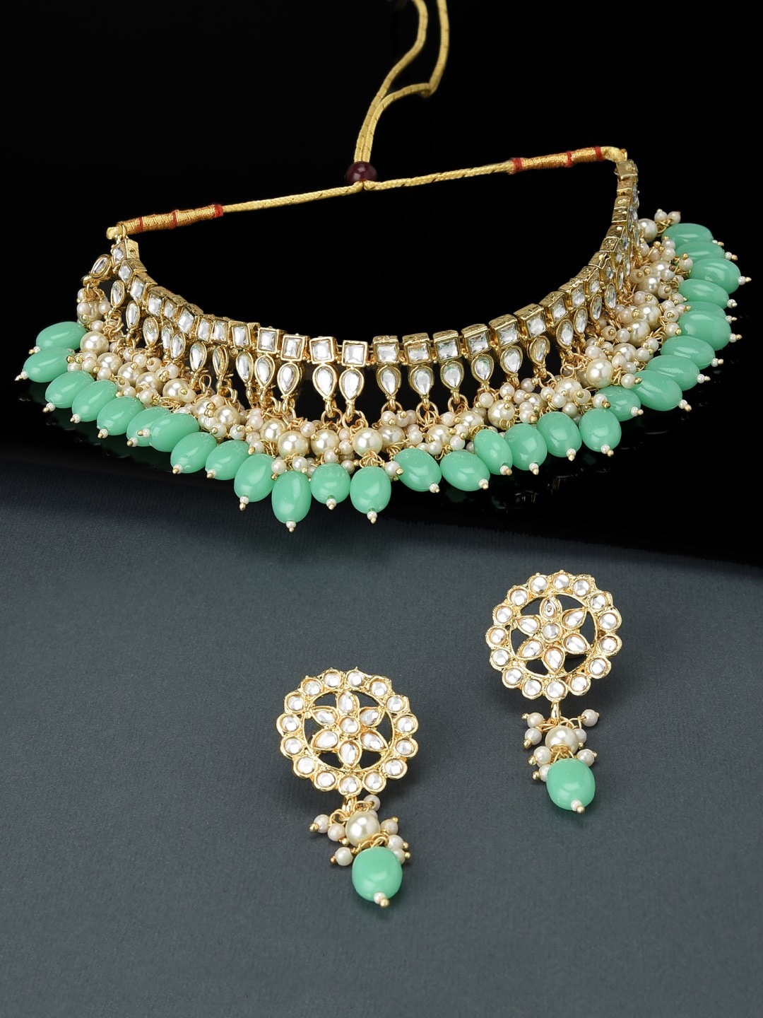 

Zaveri Pearls Gold-Plated White & Green Kundan-Studded & Beaded Jewellery Set