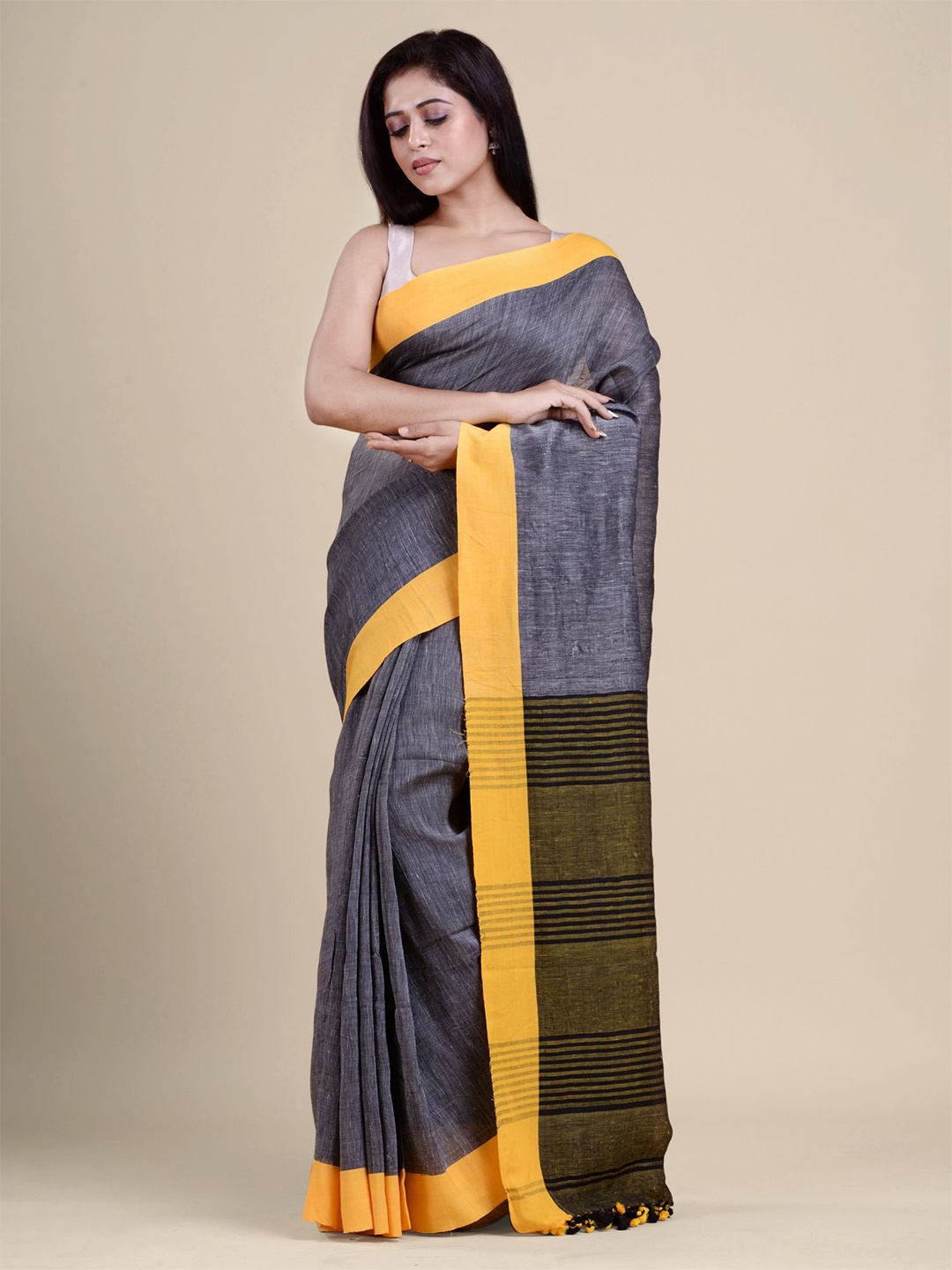 

Charukriti Grey & Yellow Pure Linen Saree