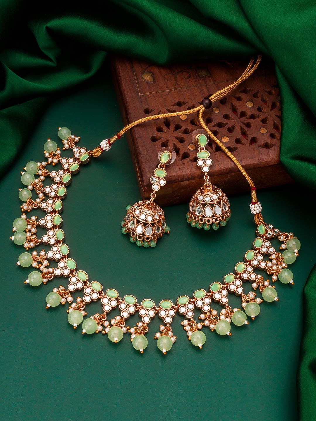 

aadita Gold-Plated Green Stone Studded & Pearls Beaded Temple Jewellery Set