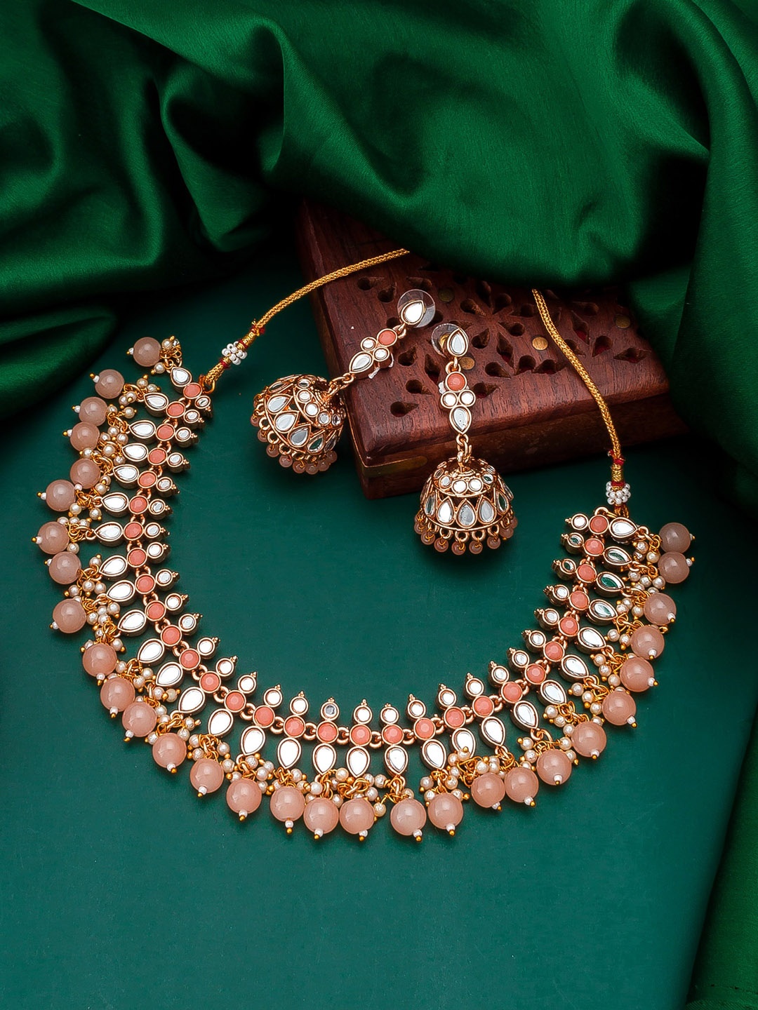 

aadita Gold-Plated Peach-Coloured Stone Studded & Pearls Beaded Temple Jewellery Set