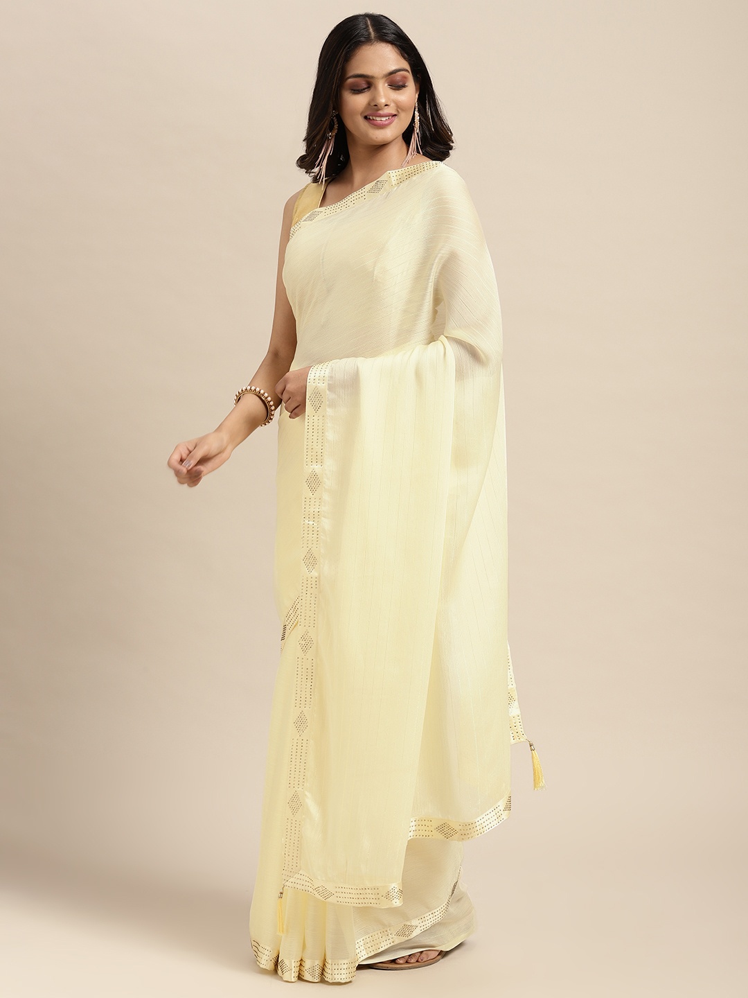

Sugathari Beige Embellished Beads and Stones Saree