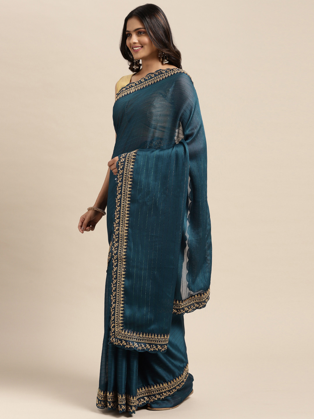 

Sugathari Teal Embellished Embroidered Saree