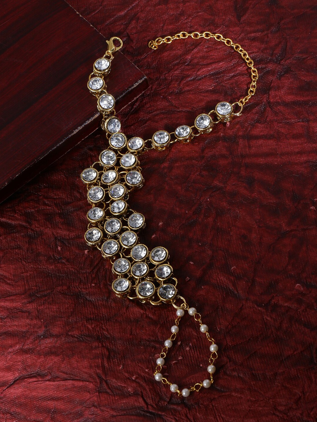 

LIVE EVIL Women Gold-Toned & White Kundan Gold-Plated Ring Bracelet