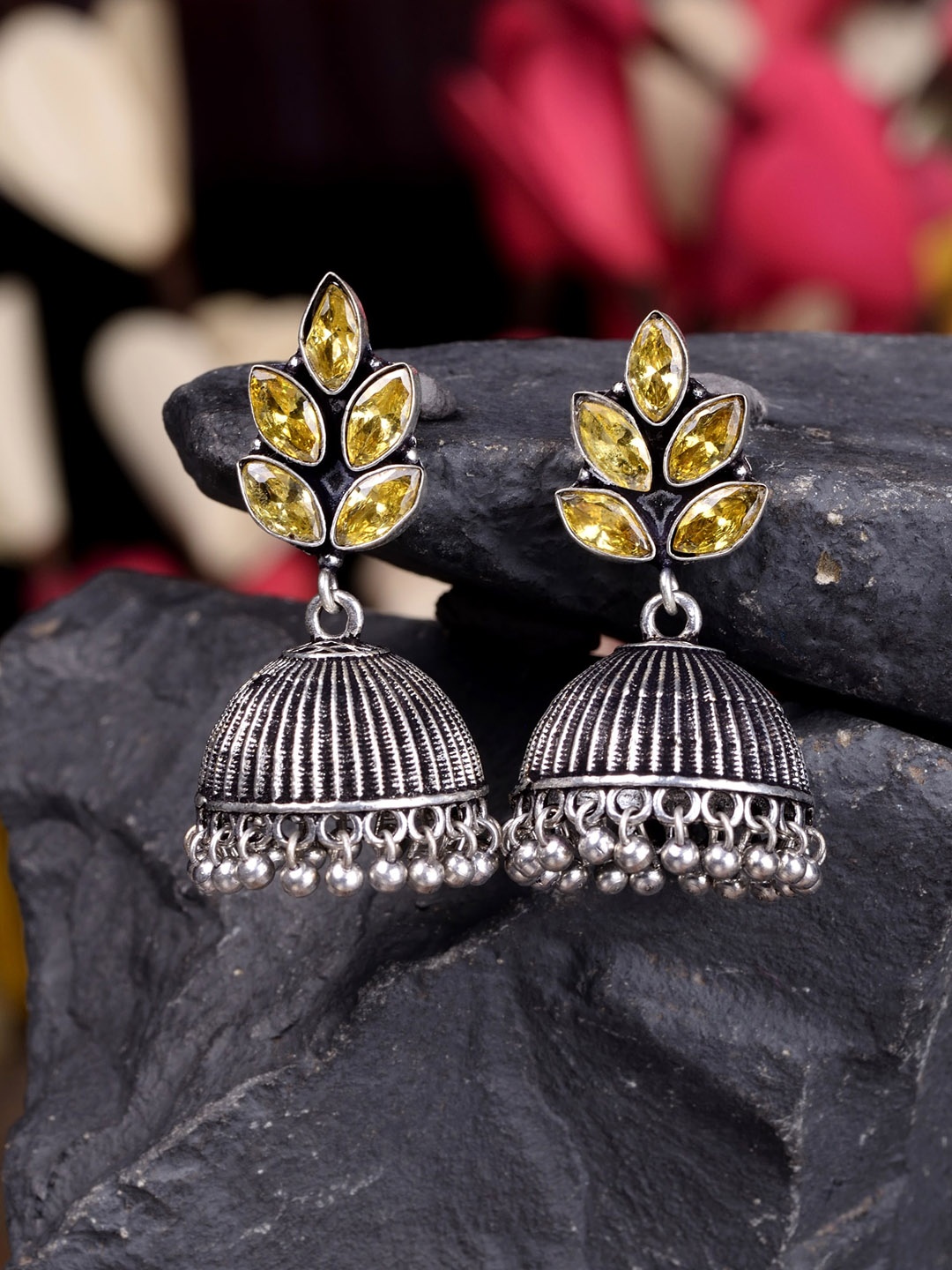 

Saraf RS Jewellery Silver-Toned & Yellow Oxidised Dome Shaped Jhumkas