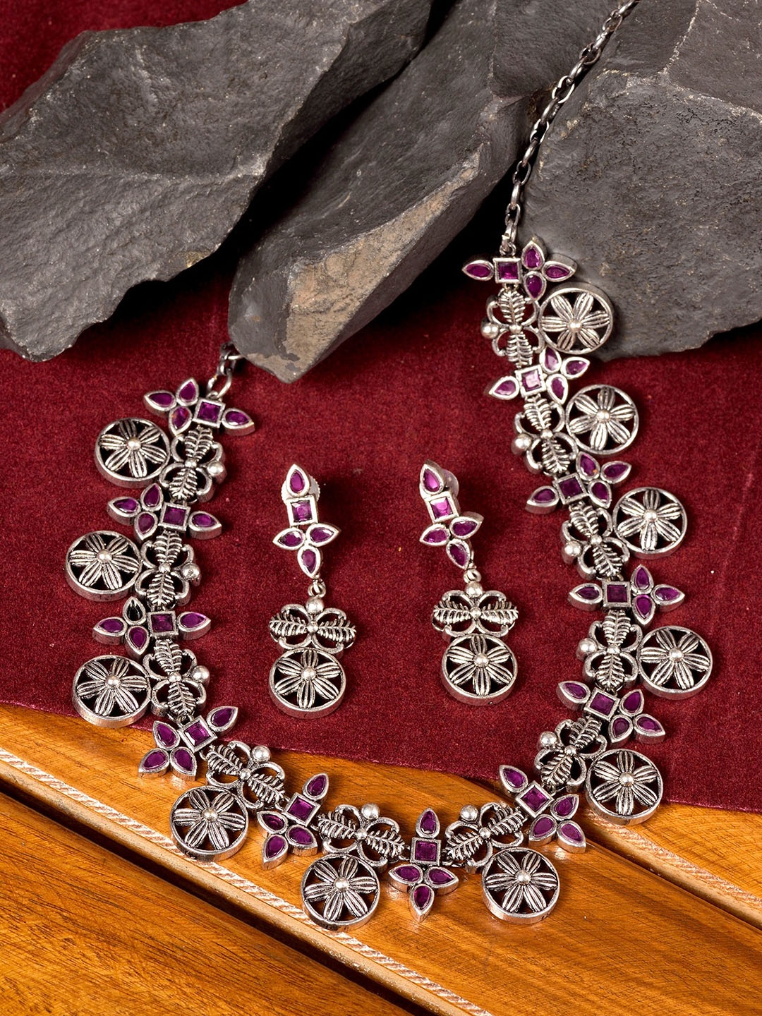 

Saraf RS Jewellery Silver-Toned & Maroon Oxidised Stone Studded Tribal Jewellery Set