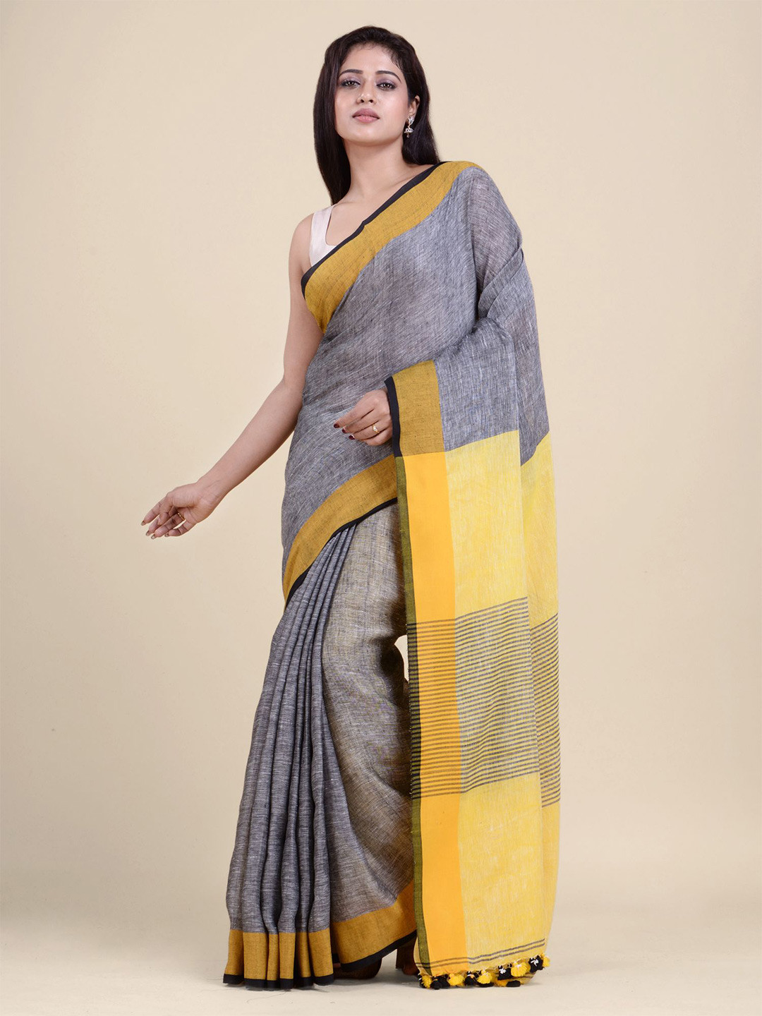 

Charukriti Blue & Yellow Pure Linen Saree