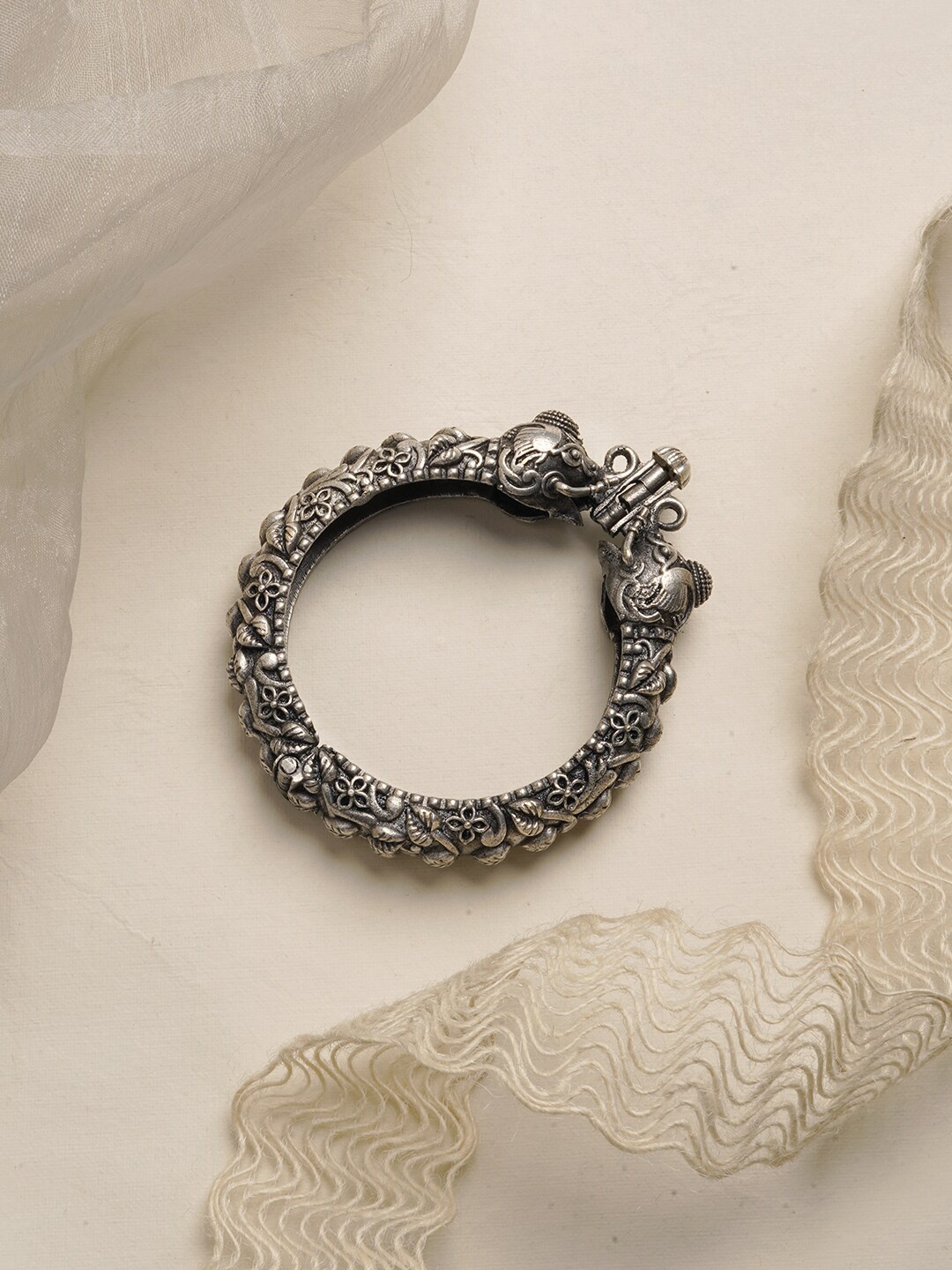 

TEEJH Silver-Plated Oxidised Suvarna Bangle