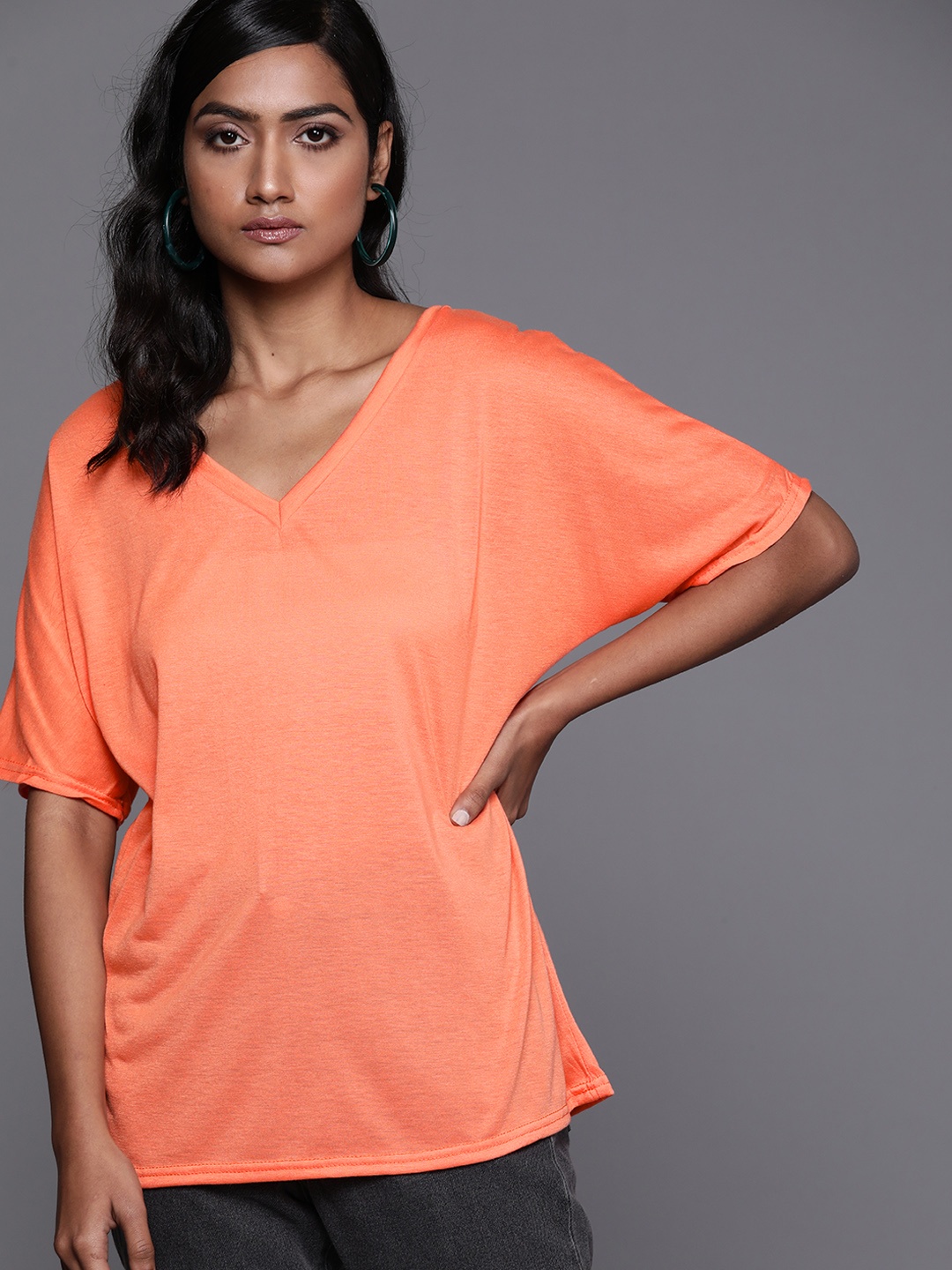 

JC Mode Peach-Coloured Solid Extended Sleeves Top