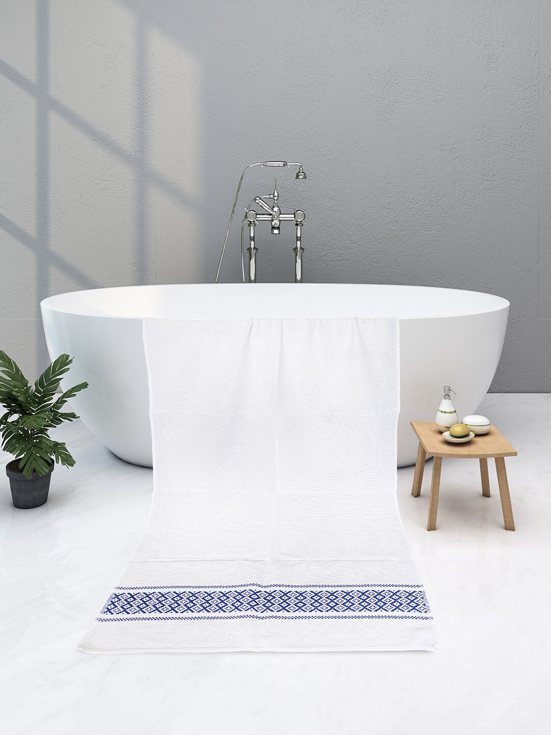 

Athom Trendz White & Blue Solid 210 GSM Pure Cotton Bath Towels