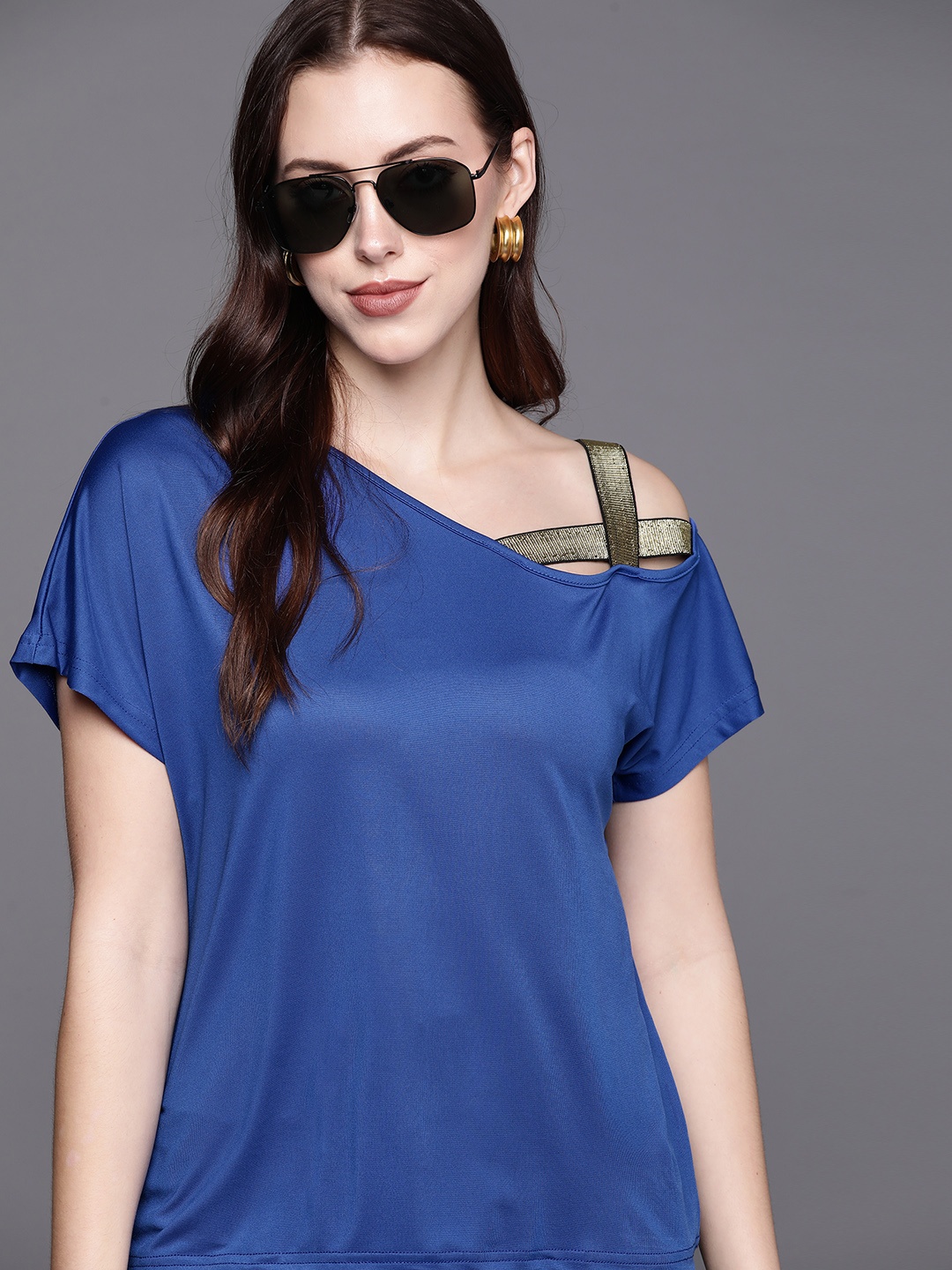 

JC Mode Women Blue Solid Stylised One Shoulder Top