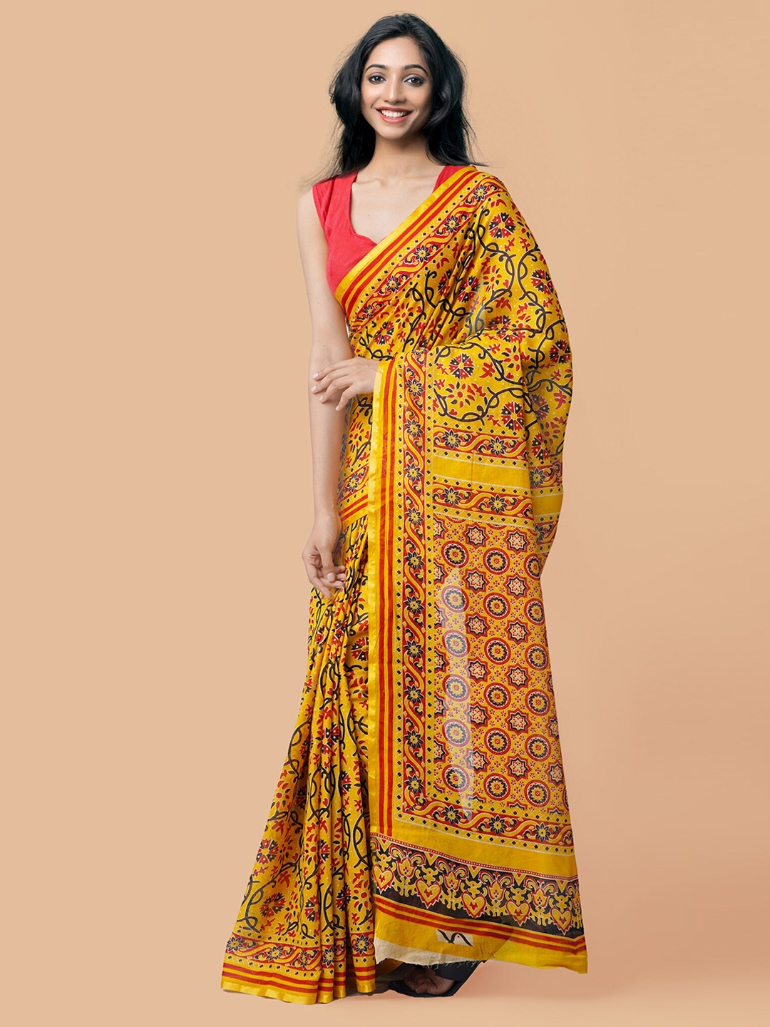 

Unnati Silks Yellow Printed Pure Handloom Patola Printed Mulmul Cotton Saree
