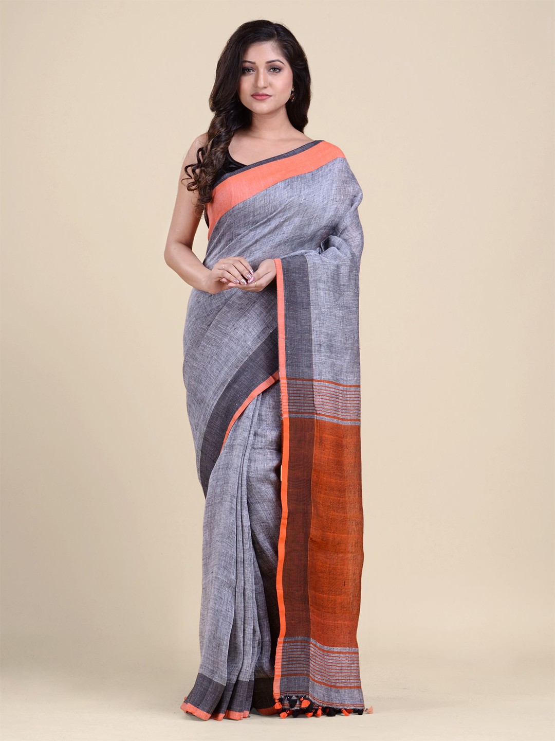 

Charukriti Grey & Orange Pure Linen Saree