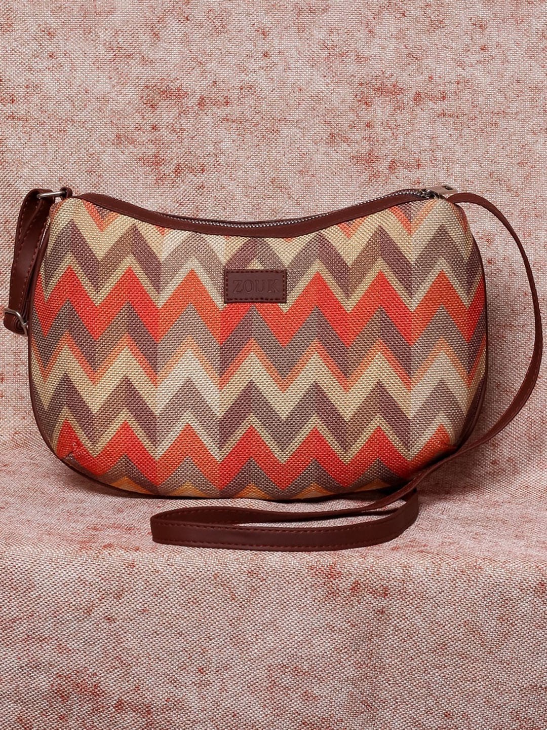 

ZOUK Orange Geometric Half Moon Sling Bag with Cut Work