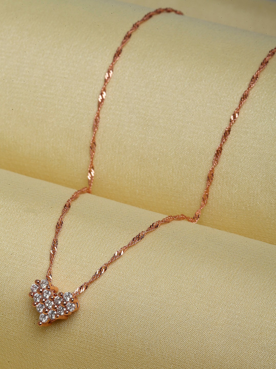 

Ferosh Rose-Gold Toned & White Stone Studded Heart Shaped Pendant With Chain