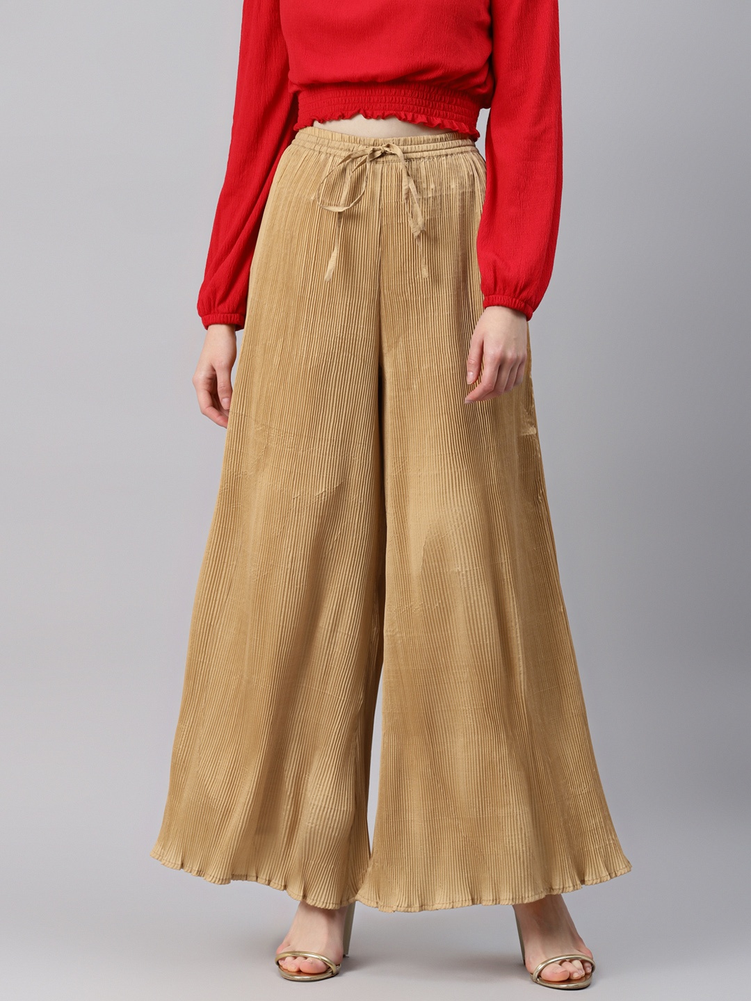 

Cottinfab Women Beige Solid Flared Palazzos