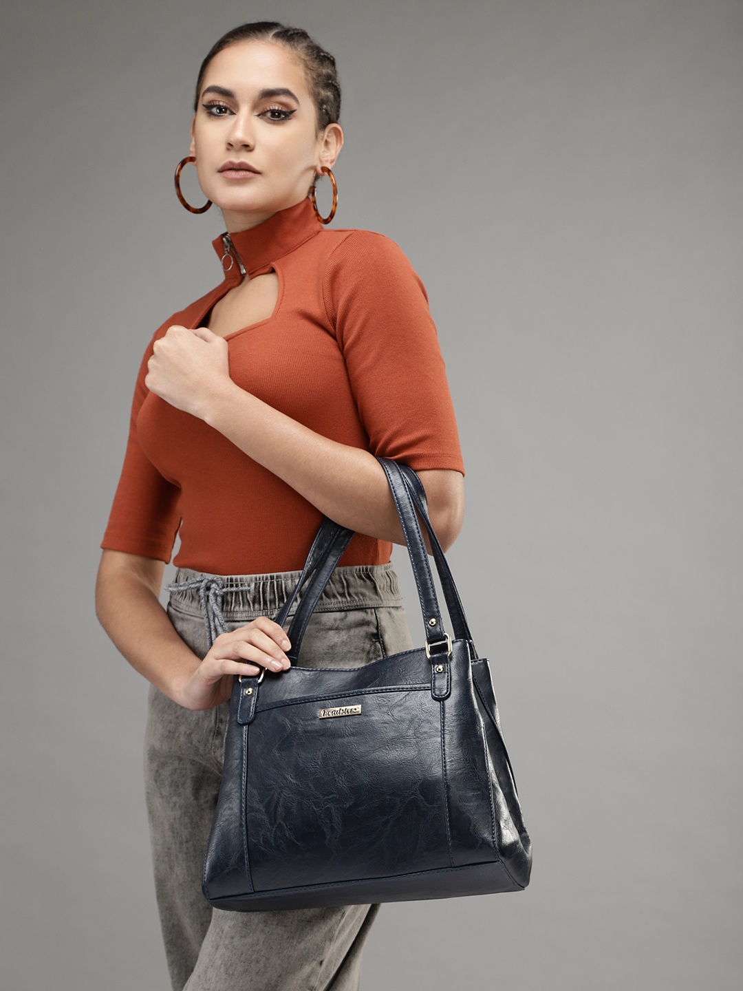 

Roadster Women Navy Blue Textured Structured Shoulder Bag