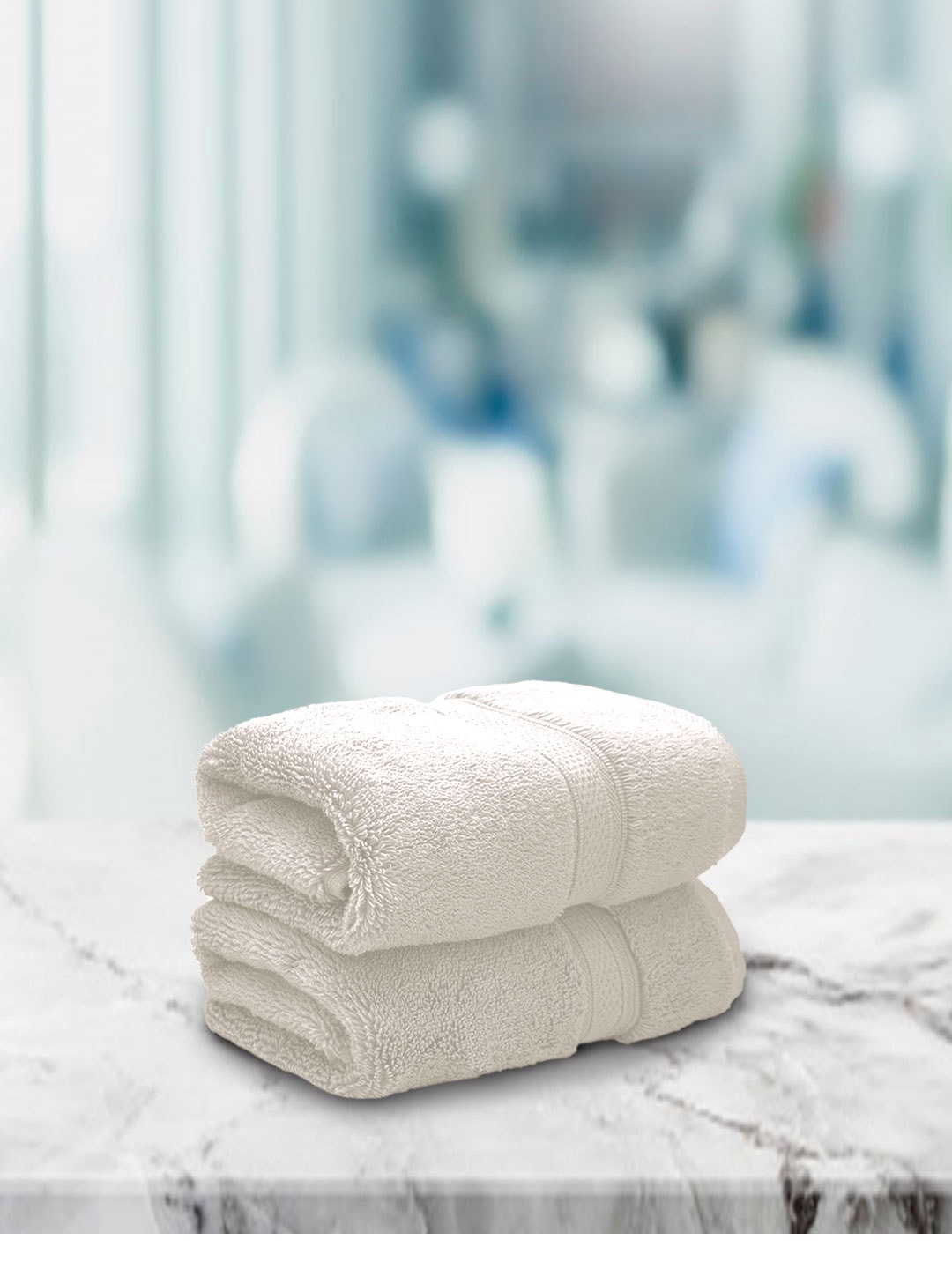 

Aura Set Of 2 Cream-Coloured Solid 650 GSM Super Absorbent Pure Cotton Hand Towels