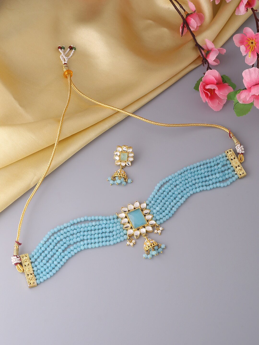 

VIRAASI Gold-Toned & Blue Kundan Studded & Beaded Jewellery Set
