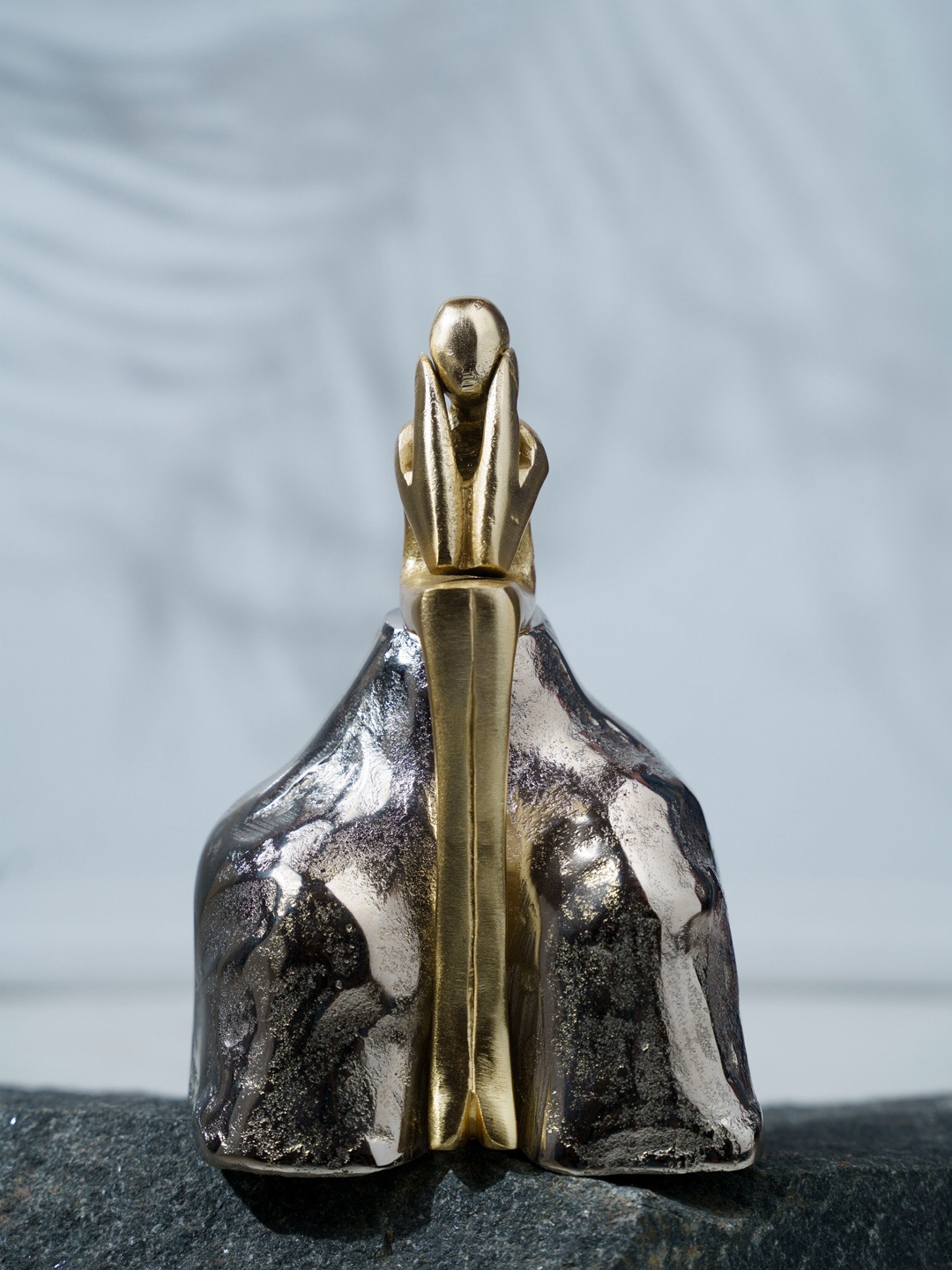 

Folkstorys Silver-Toned & Gold-Toned The Man & The Rock Sculpture Showpiece