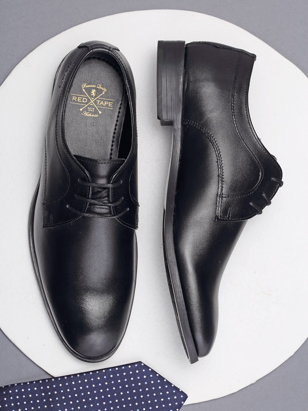 

Red Tape Men Black Solid Leather Derbys