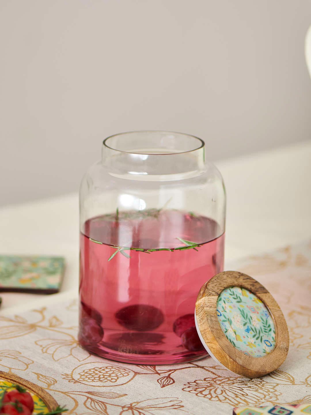 

Chumbak Brown & Green Glass Jar With Wooden Lid, Transparent
