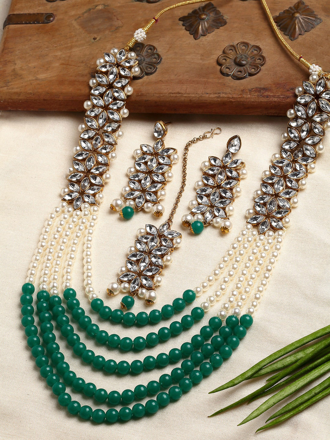 

ZENEME Woman Green & White Pearl Beaded Kundan Studded Multi-Stranded Jewellery Set